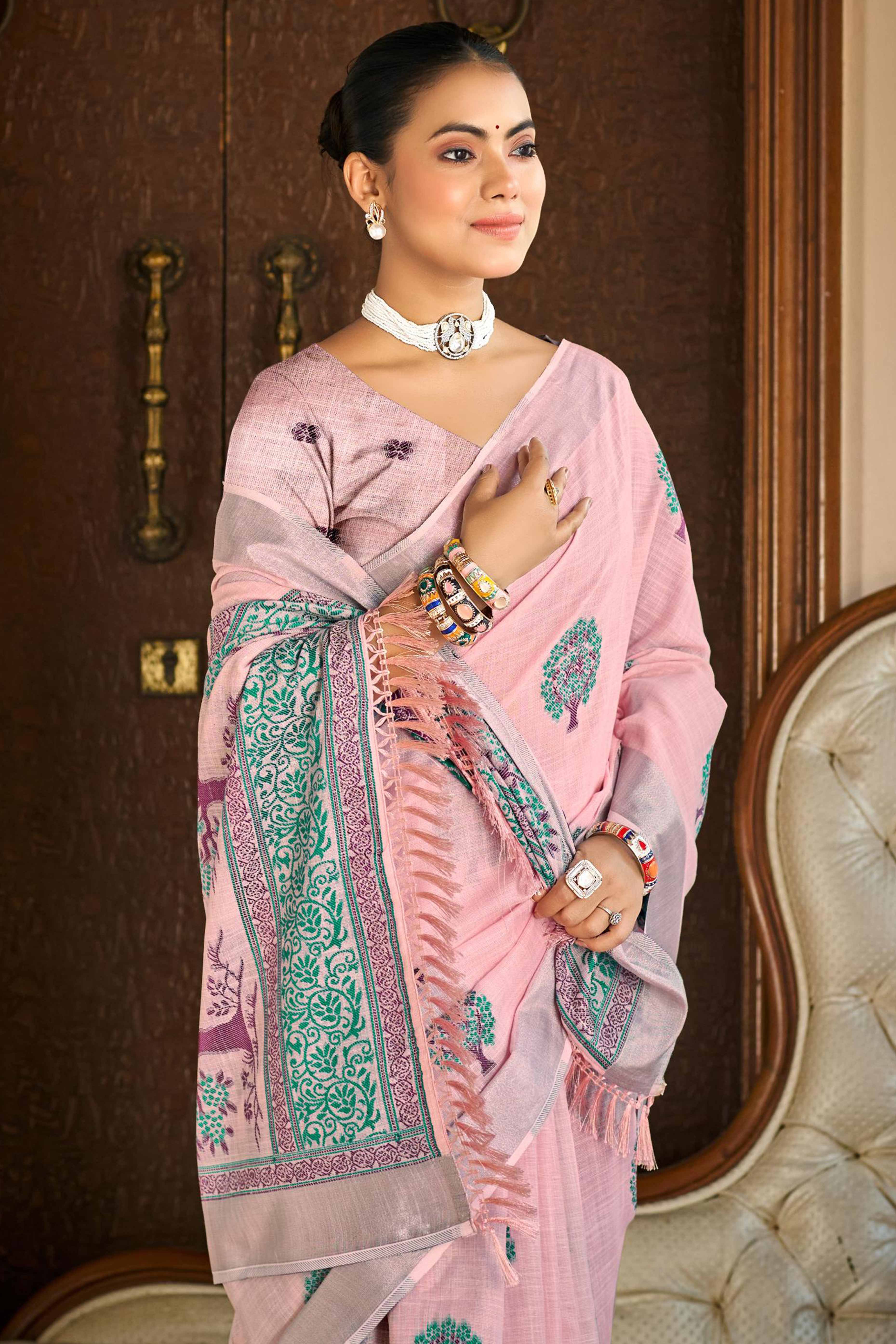 Pink Linen Saree Adorned With Intricate Zari Weaving & Tassel Pallu