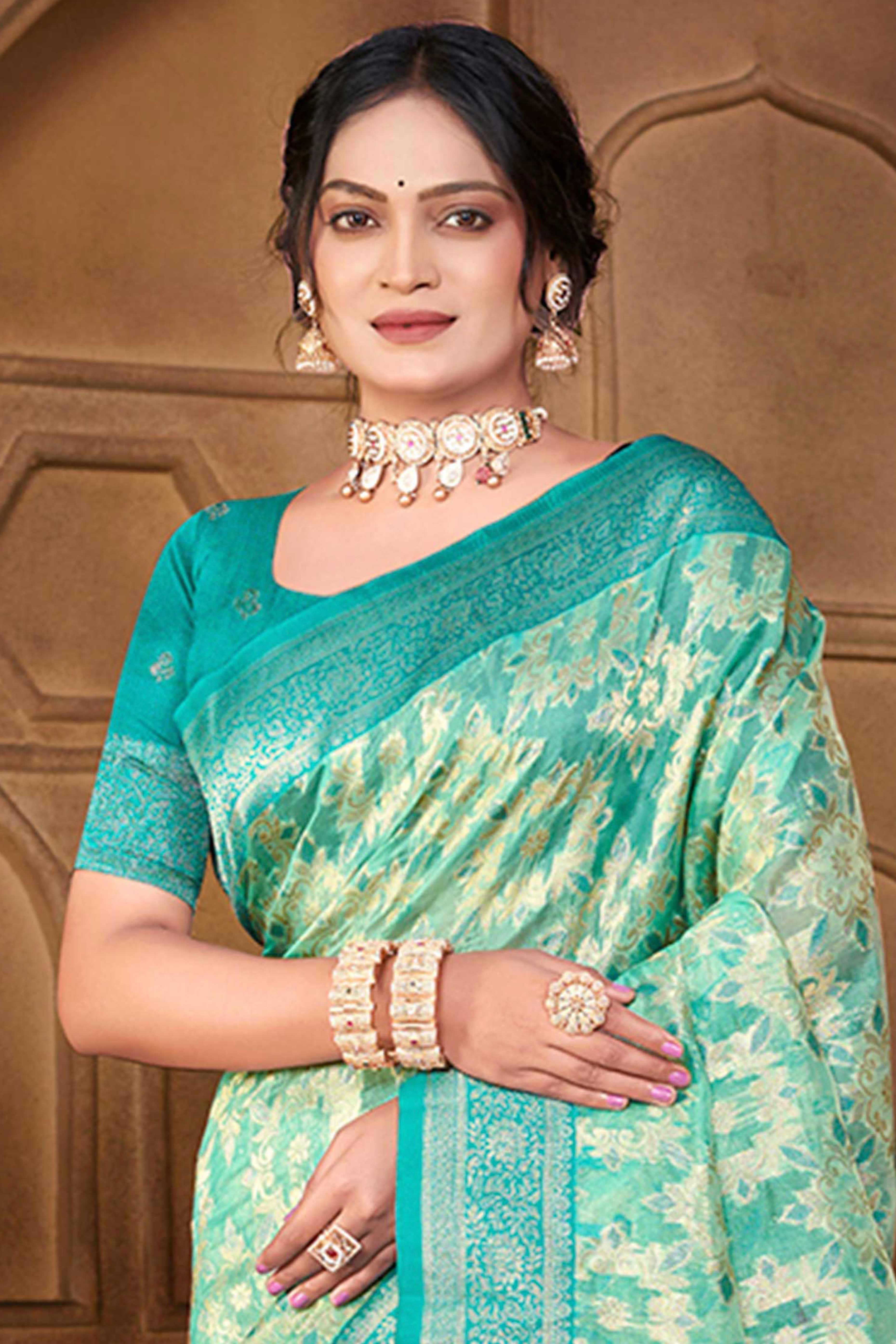 Stunning Turquoise Blue Floral Weaving Silk Blend Saree Enhanced With A Stylish Tassel Pallu