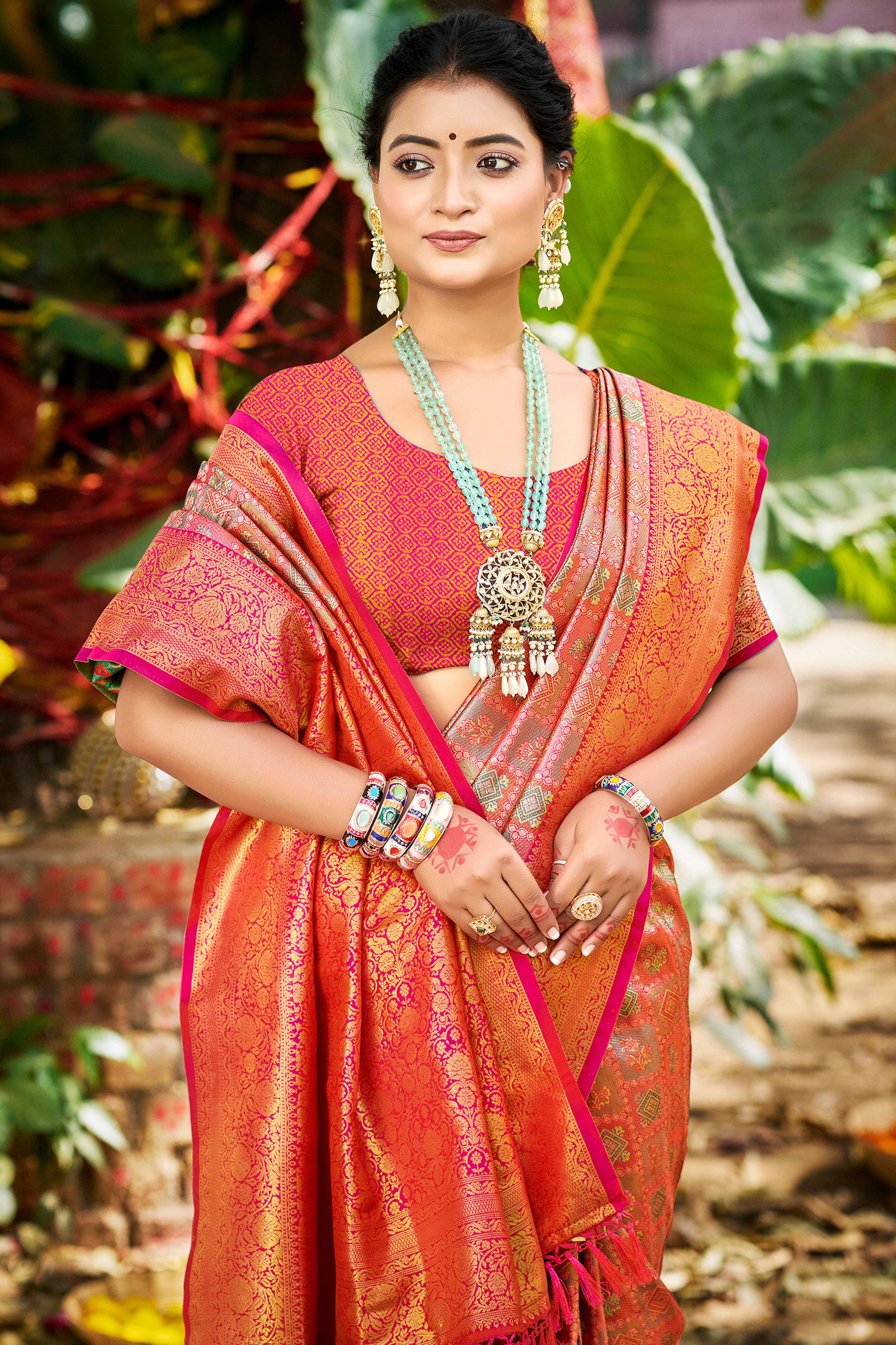 Pink Silk Blend Dharmavaram Saree Featuring Ornate Floral Weaves & Tassels Pallu