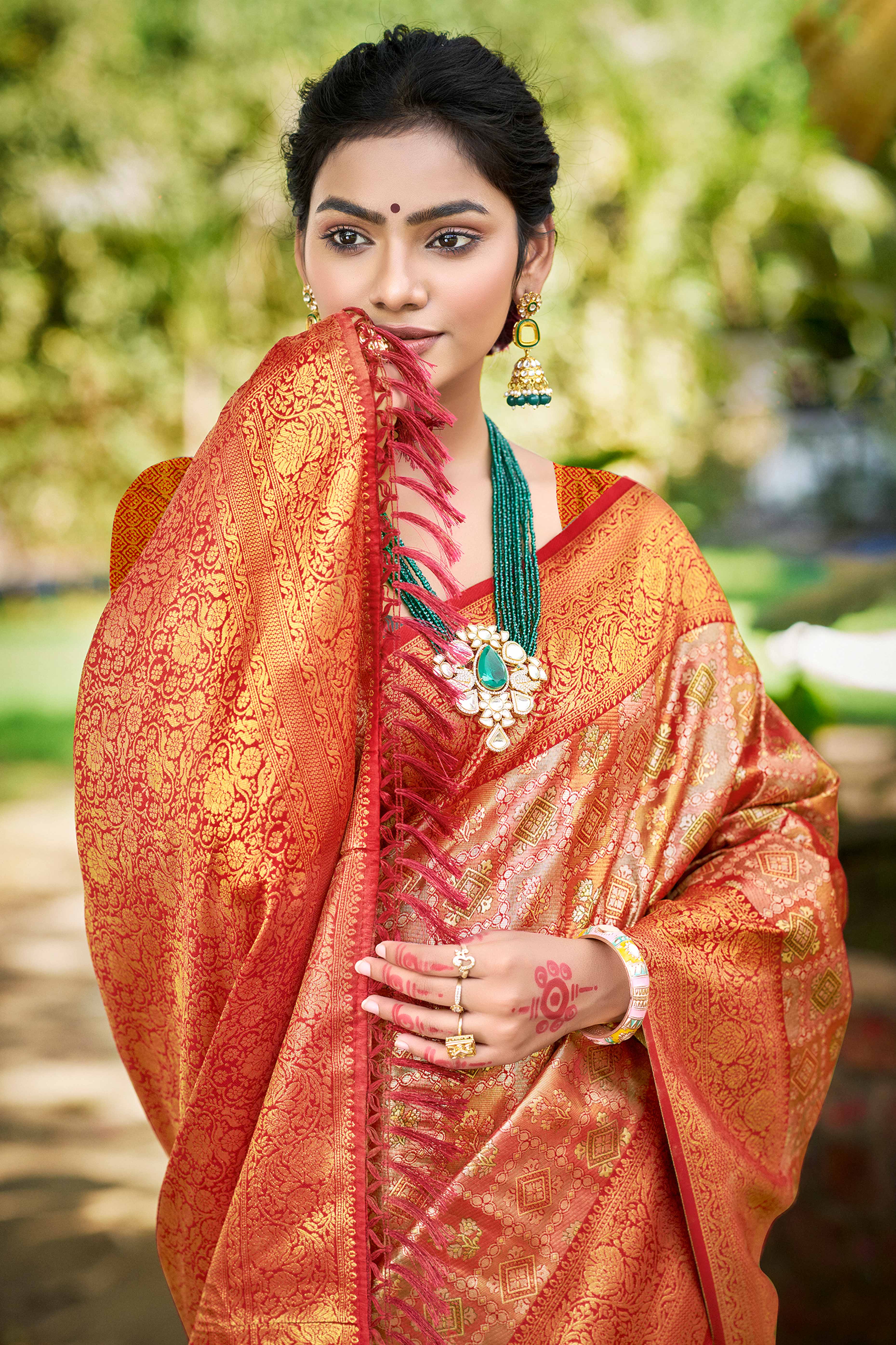 Red Silk Blend Dharmavaram Saree Featuring Ornate Floral Weaves & Tassels Pallu