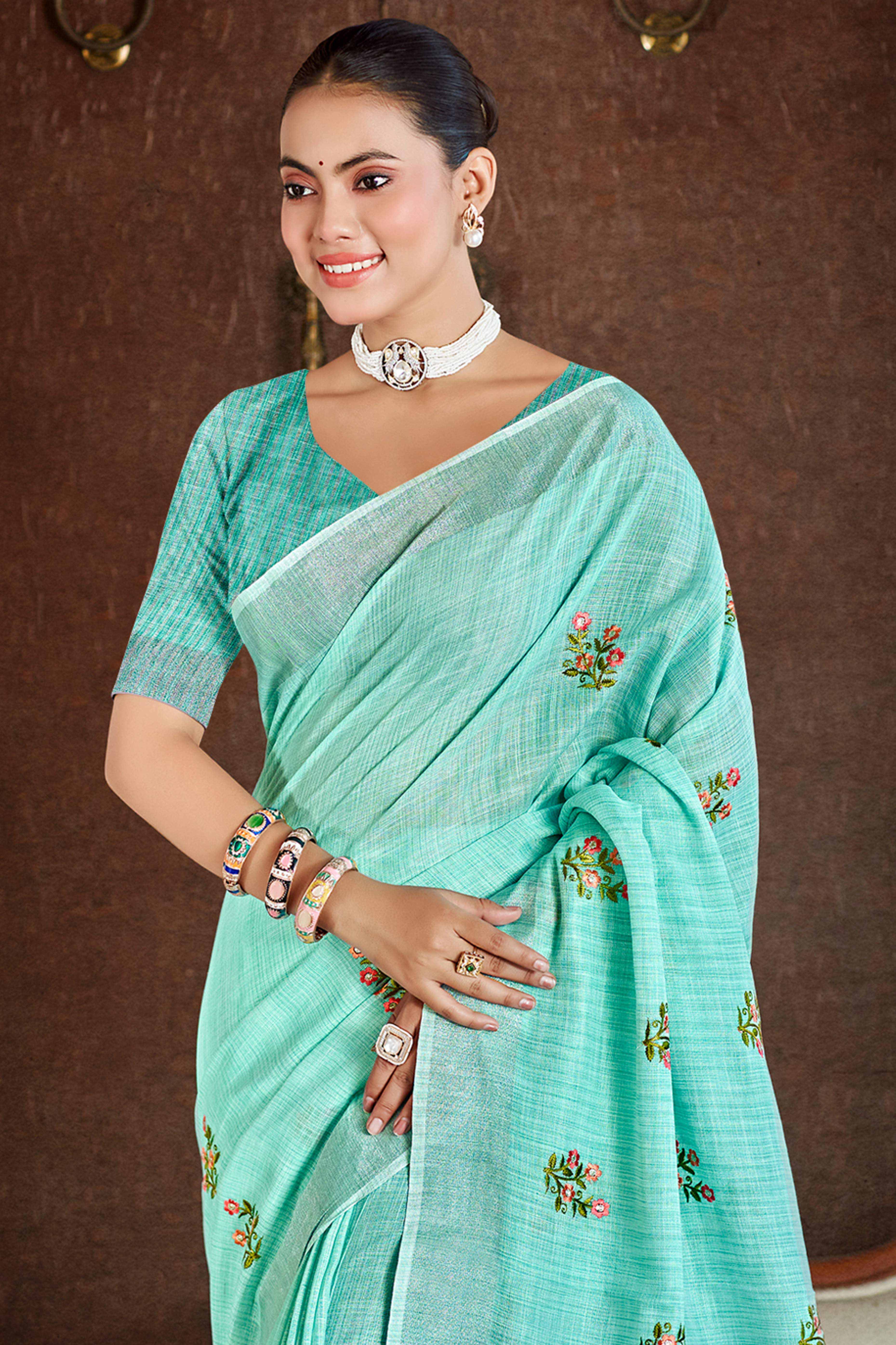 Turquoise Embroidered Linen Saree with Floral Motifs in Woven Fabric
