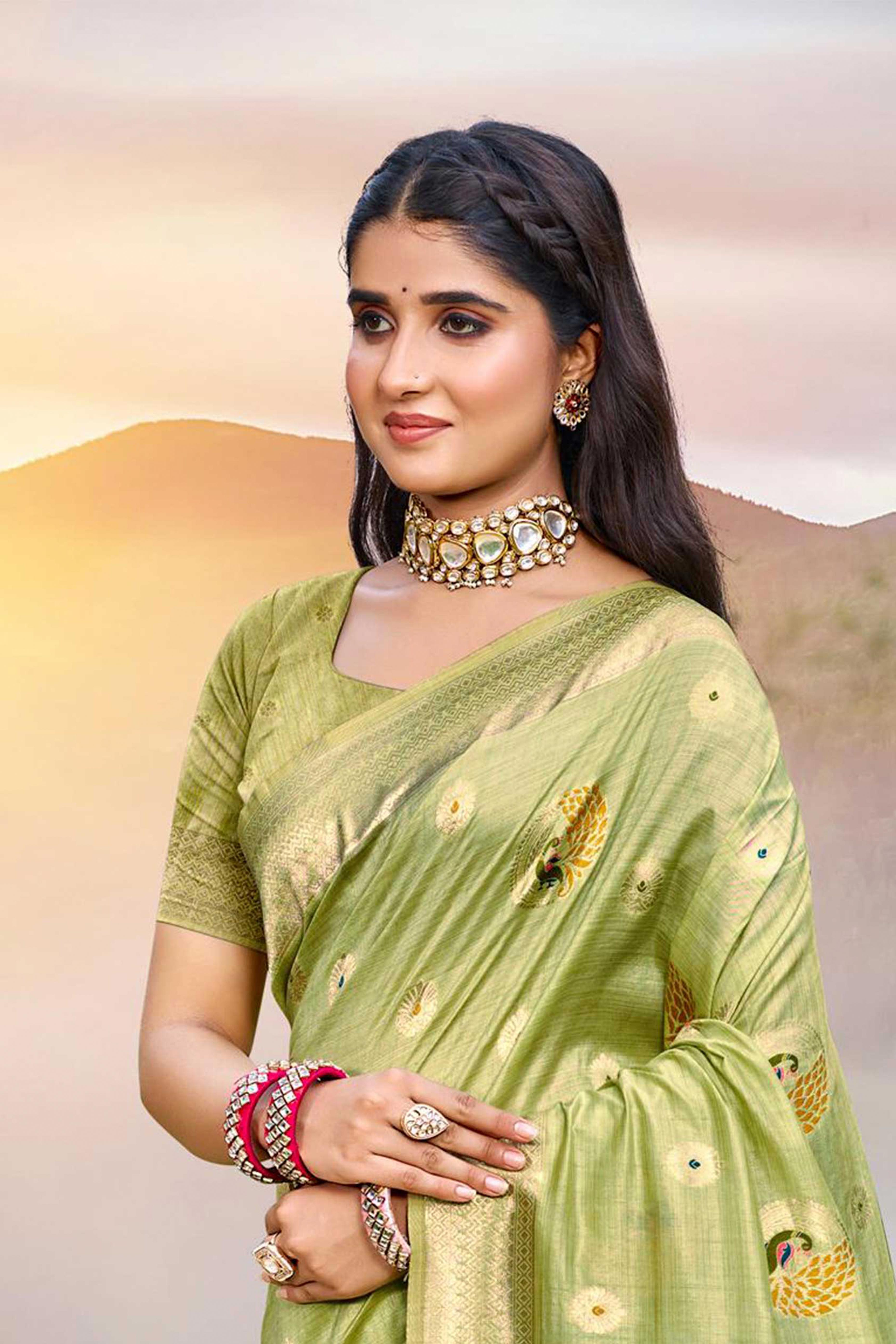 Designer Green Assam Silk Blend Saree Adorned With Peacock Zari Weaving & Tassel Pallu