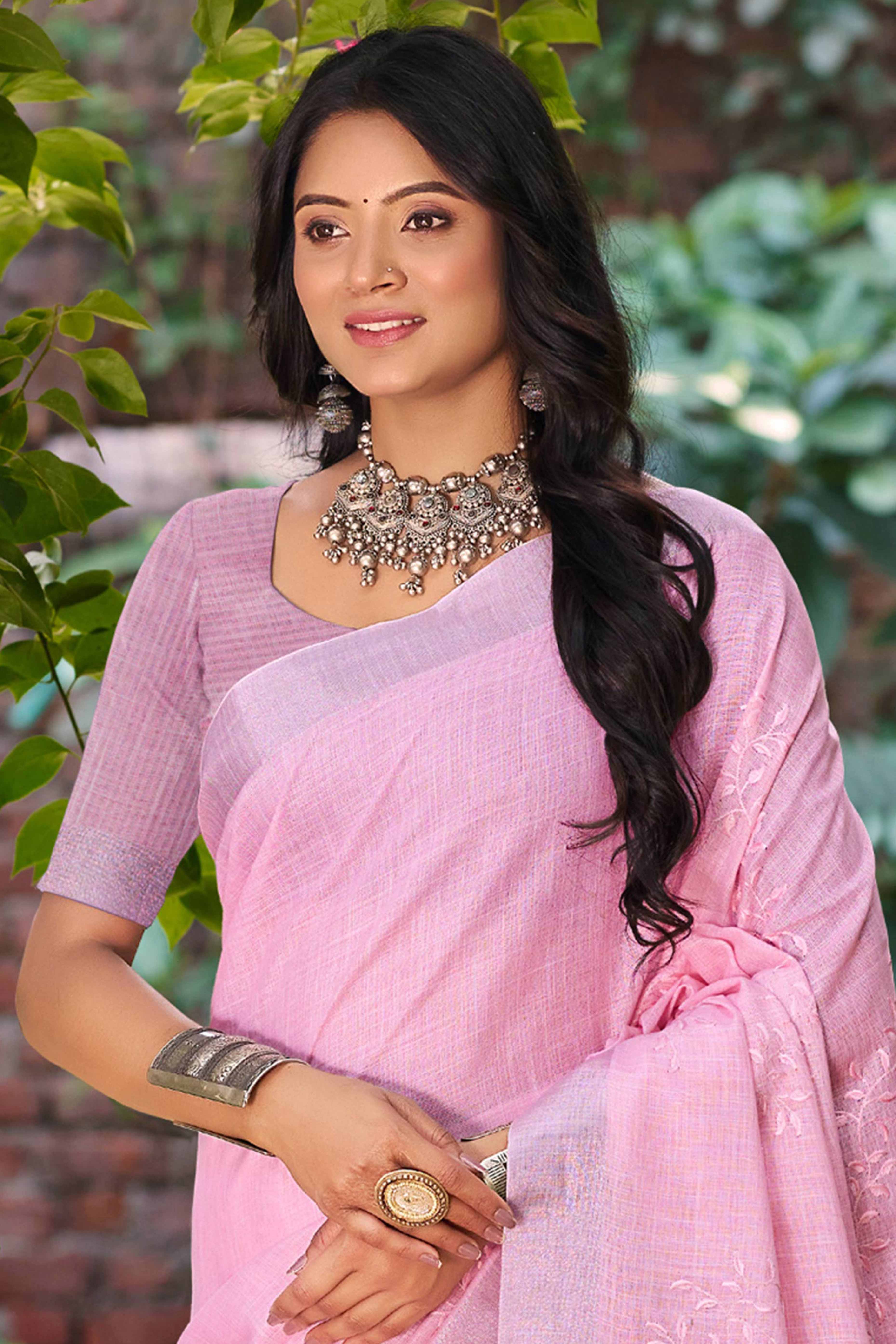 Elegant Dark Pink Linen Saree Featuring Intricate Woven & Embroidered Patterns