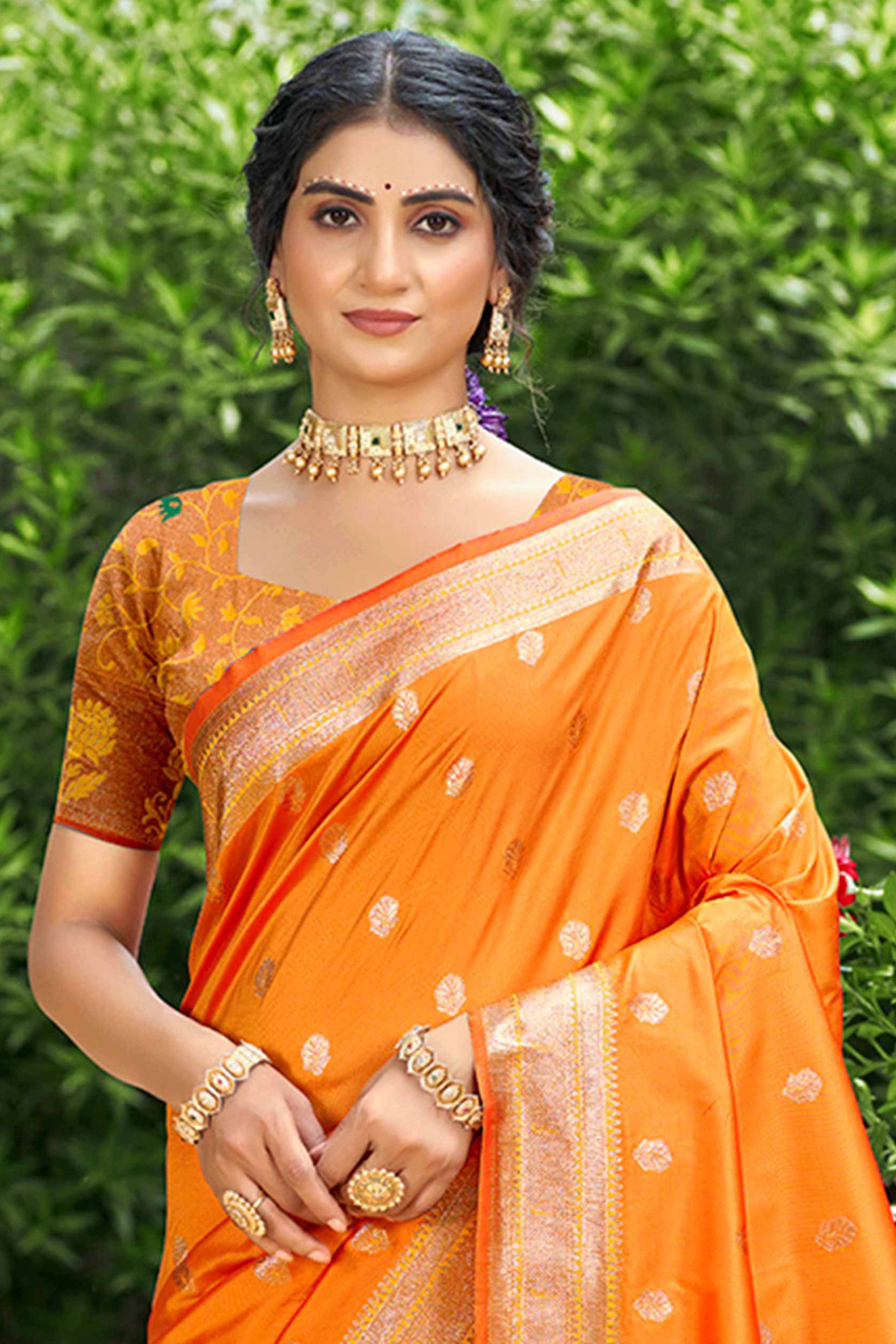 Orange Zari Weaving Silk Blend Saree Adorned With Intricate Peacock Motif Pallu & Graceful Tassel