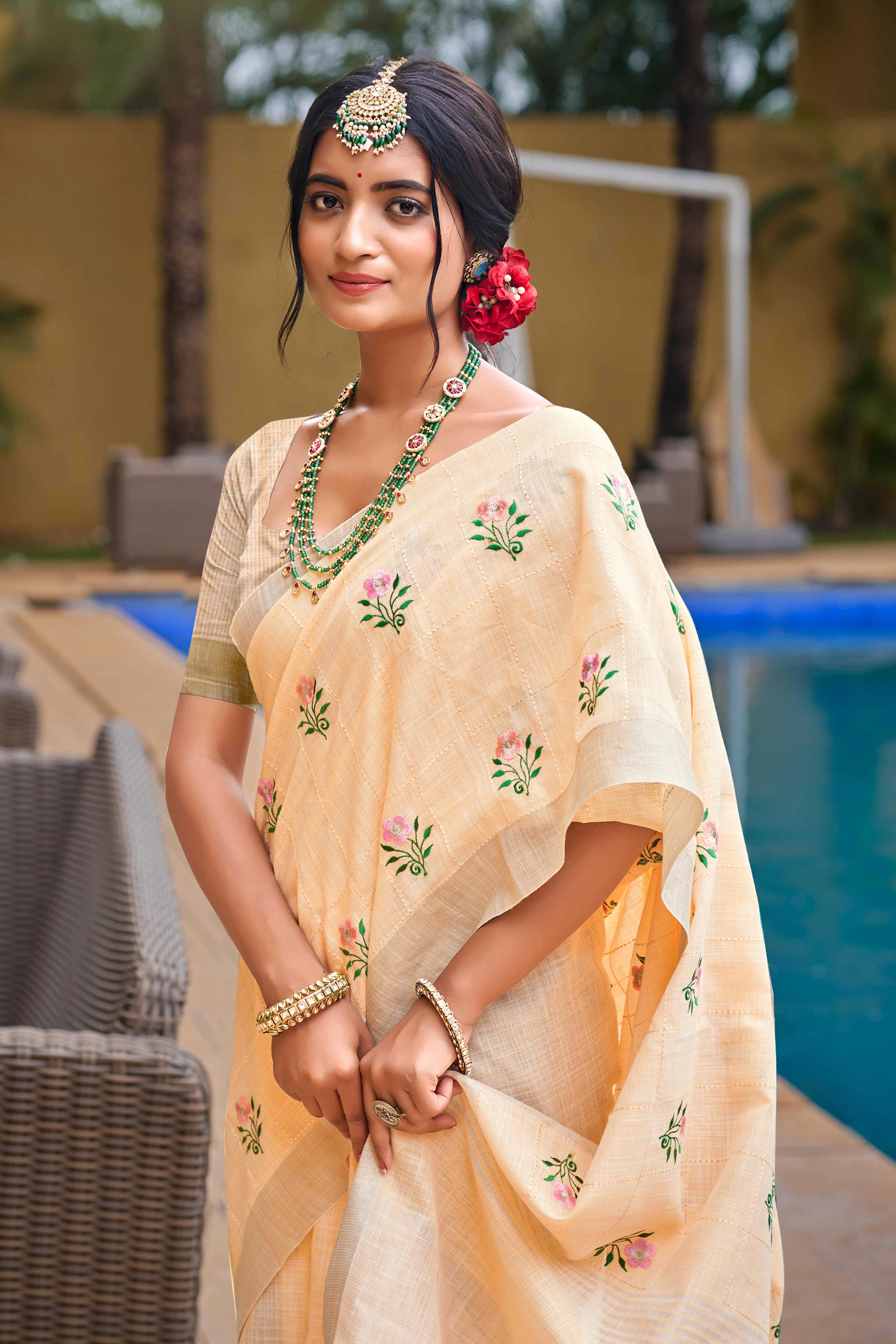 Captivating Light Peach Floral Thread Embroidered Linen Saree With Elegant Weaving Border
