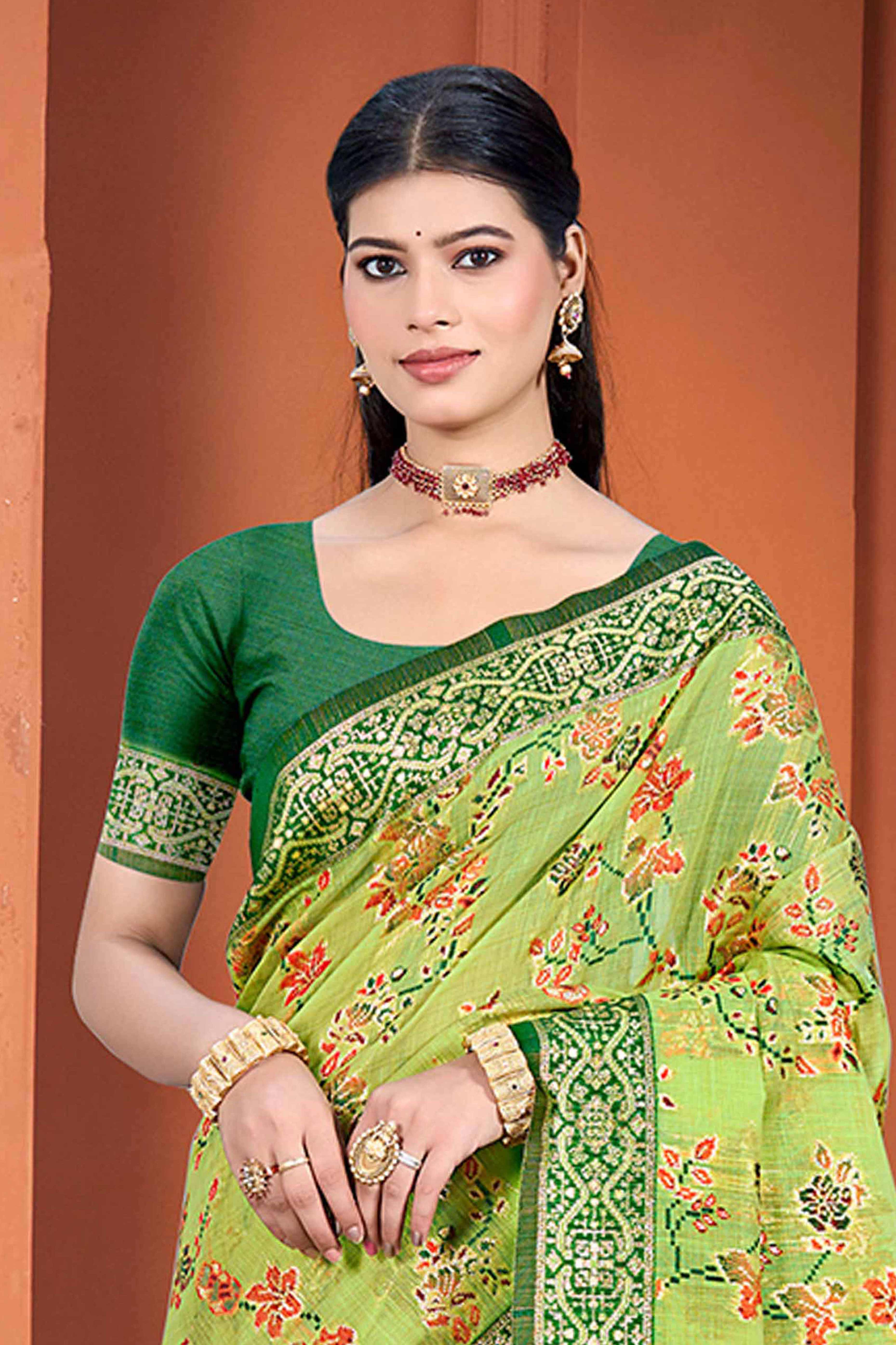 Stunning Green Floral Zari Weaving Cotton Silk Meena Saree With Tassel Pallu