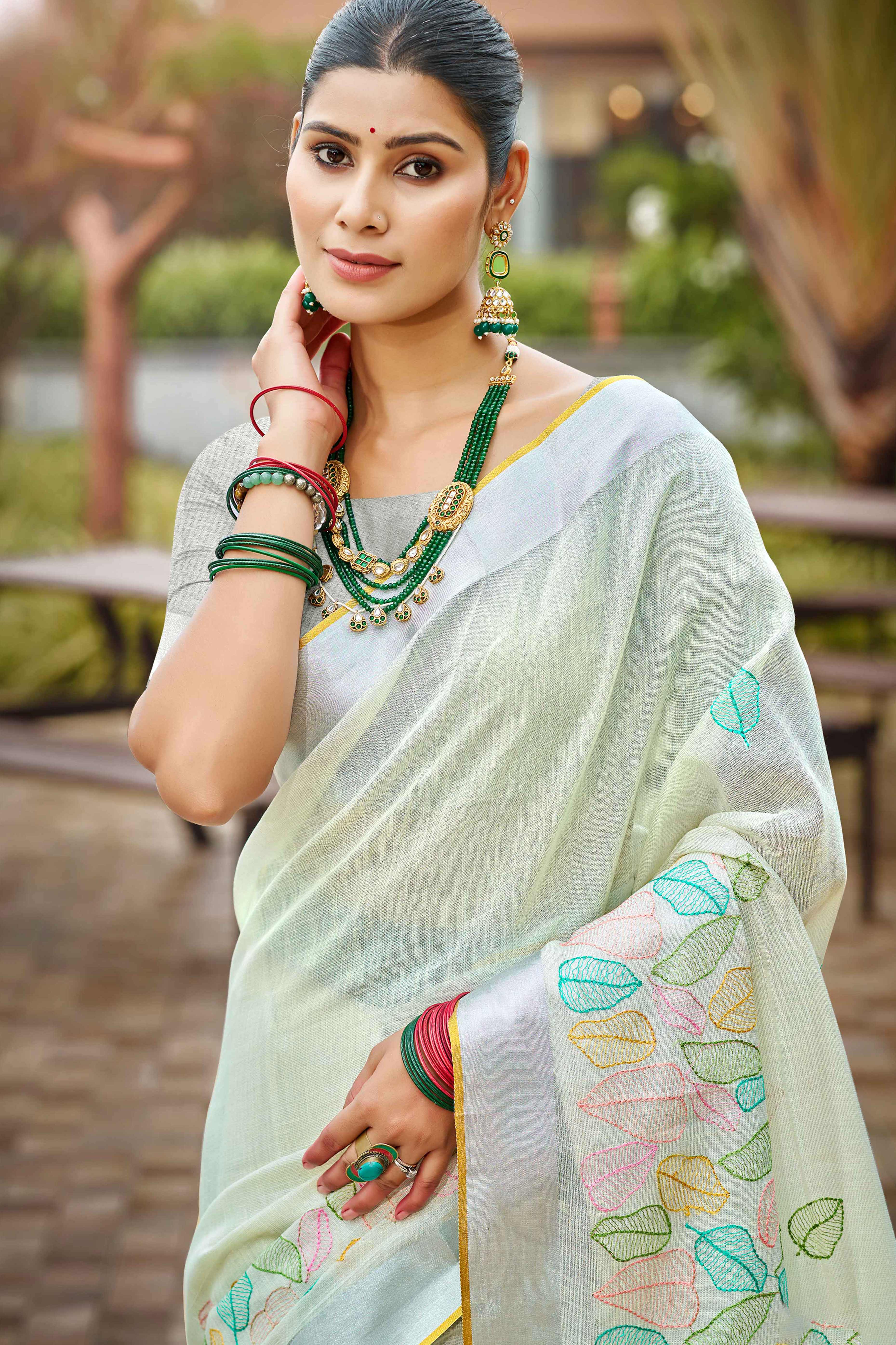 Classic Offwhite Leaf Pattern Thread Embroidery Work Linen Saree With Tassel Pallu