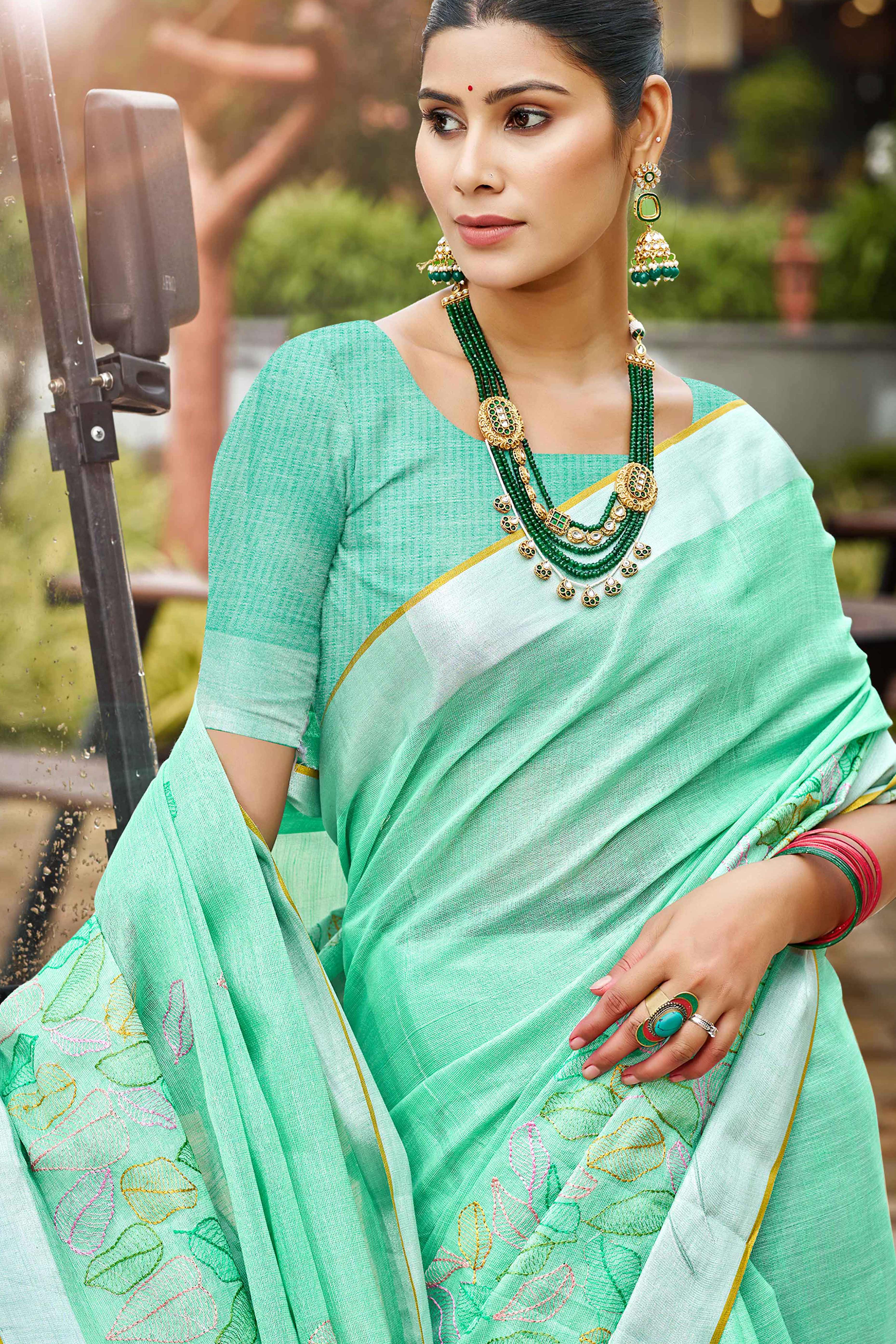 Classic Sea Green Leaf Pattern Thread Embroidery Work Linen Saree With Tassel Pallu