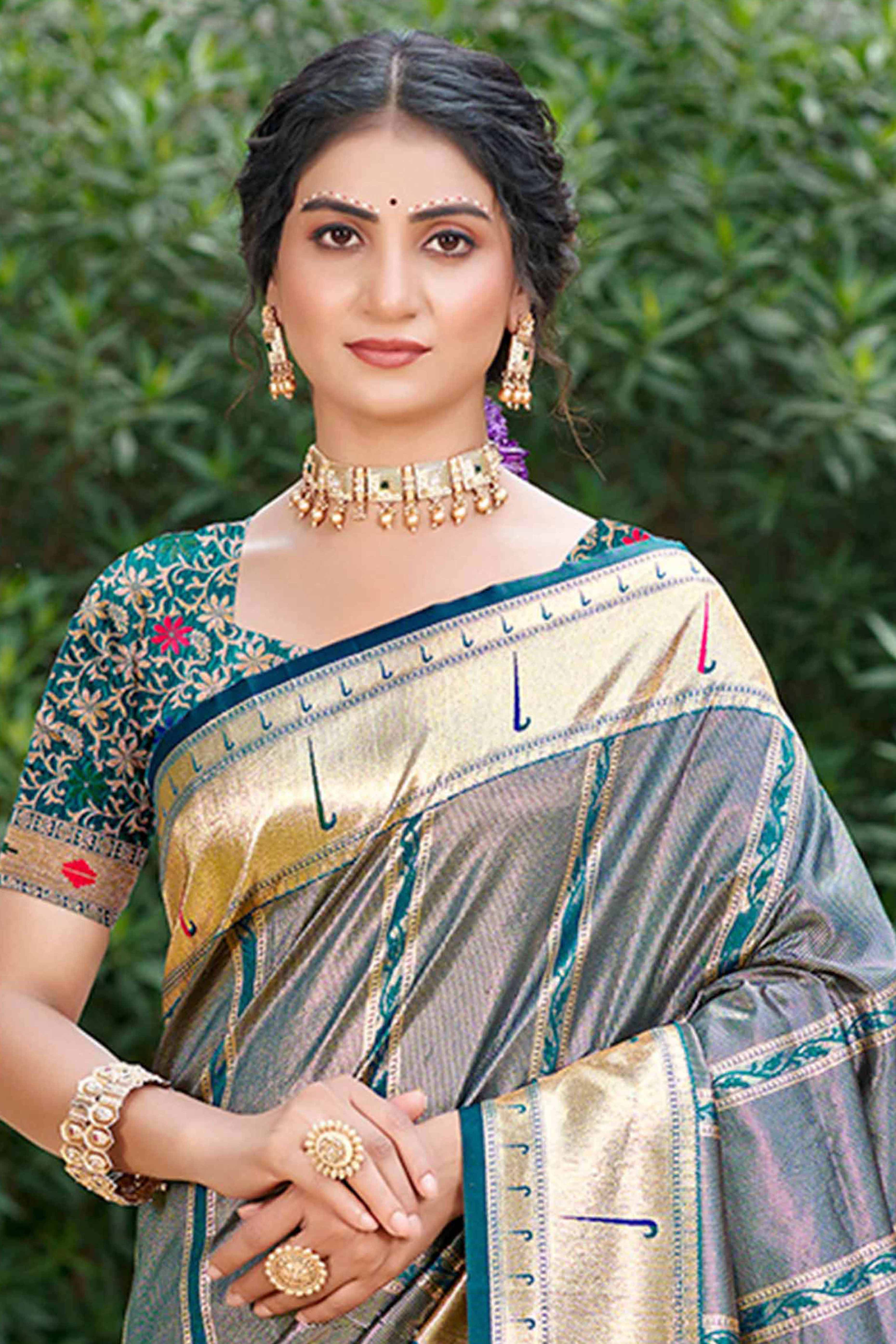 Teal Designer Weaving Silk Blend Saree Accented With Graceful Peacock & Floral Motif Pallu