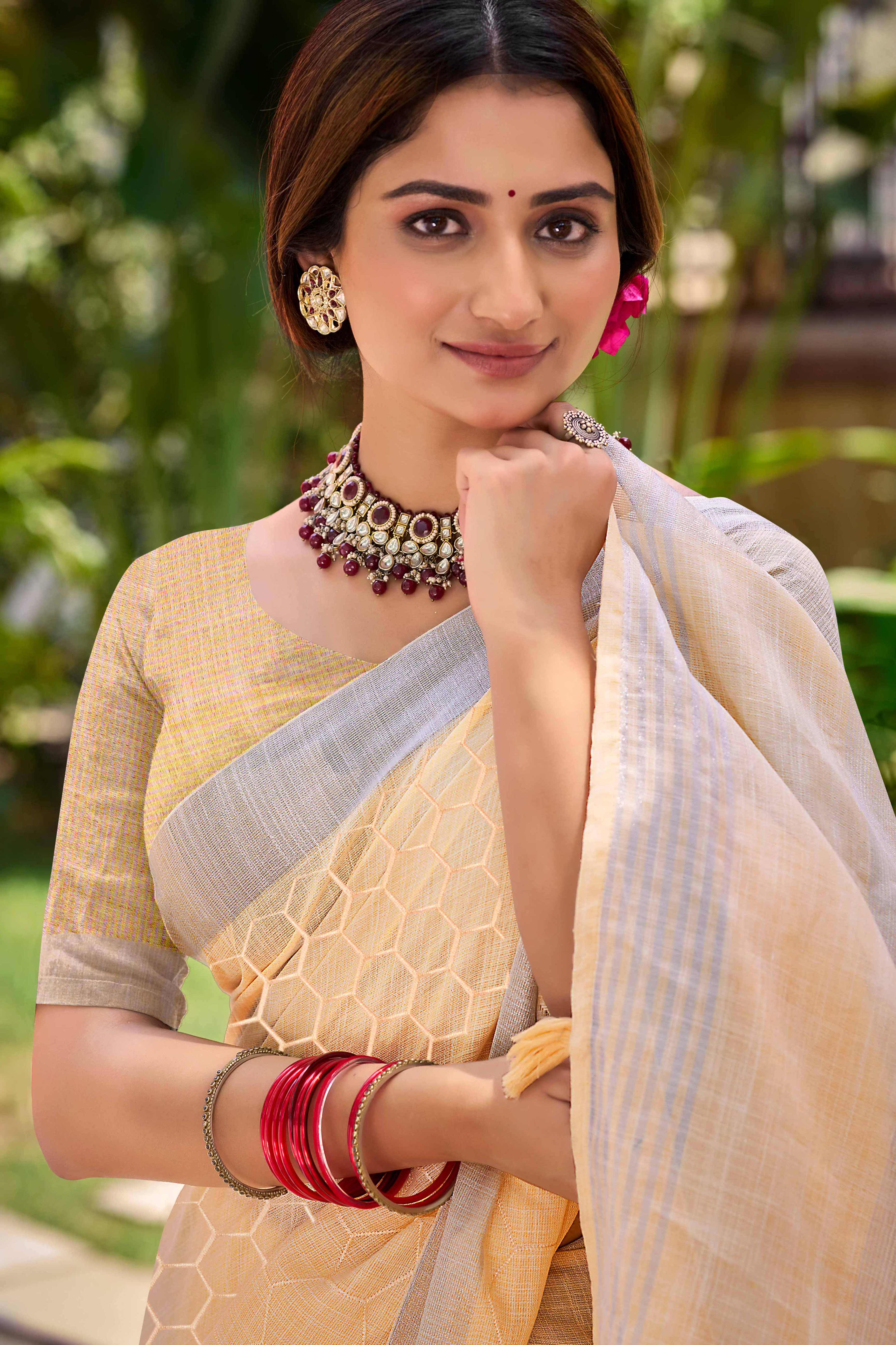 Light Peach Classic Linen Saree Enhanced With Fine Geometric Embroidery Work & Tassel Pallu