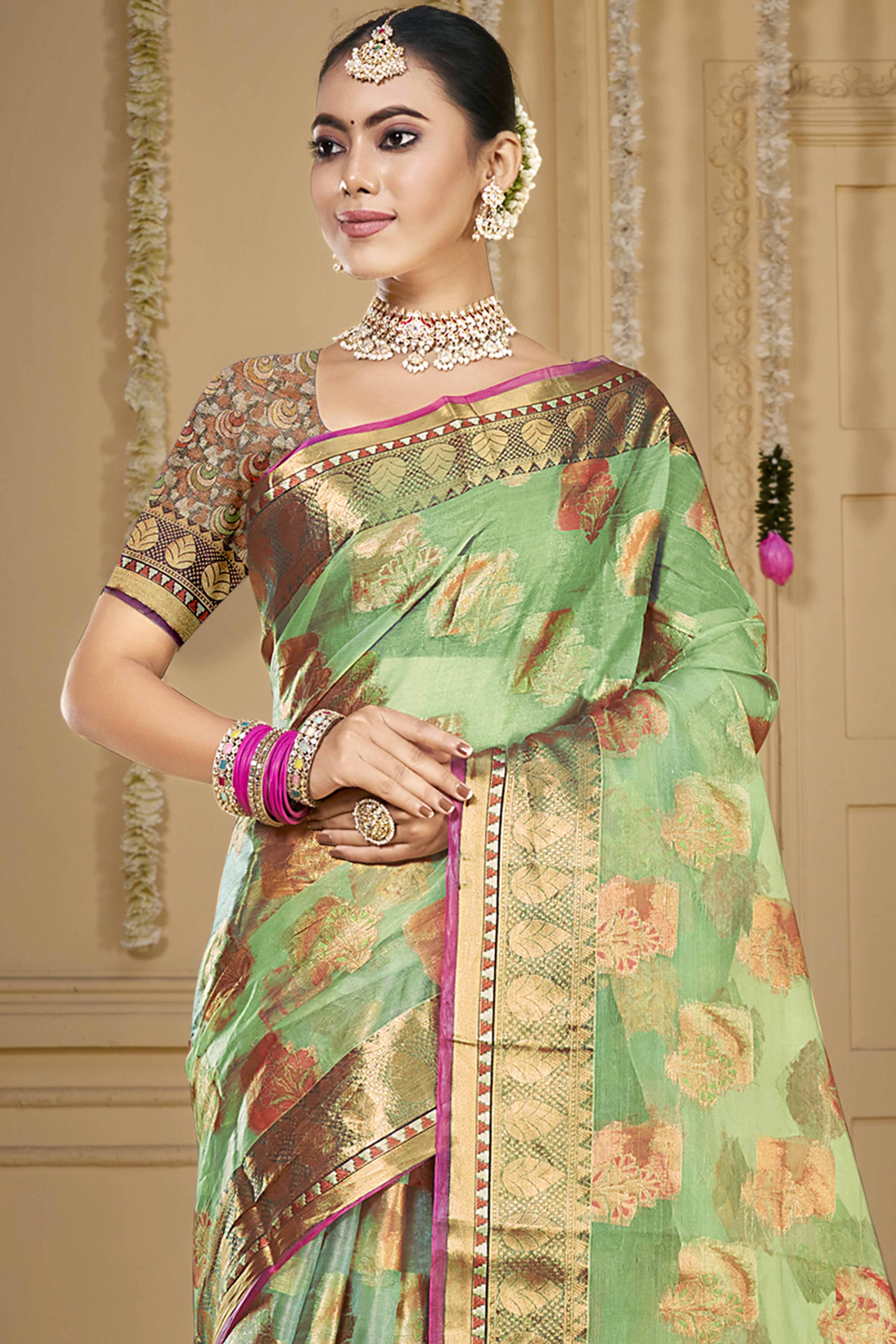 Pista Green Floral Woven Organza Saree With Tassels