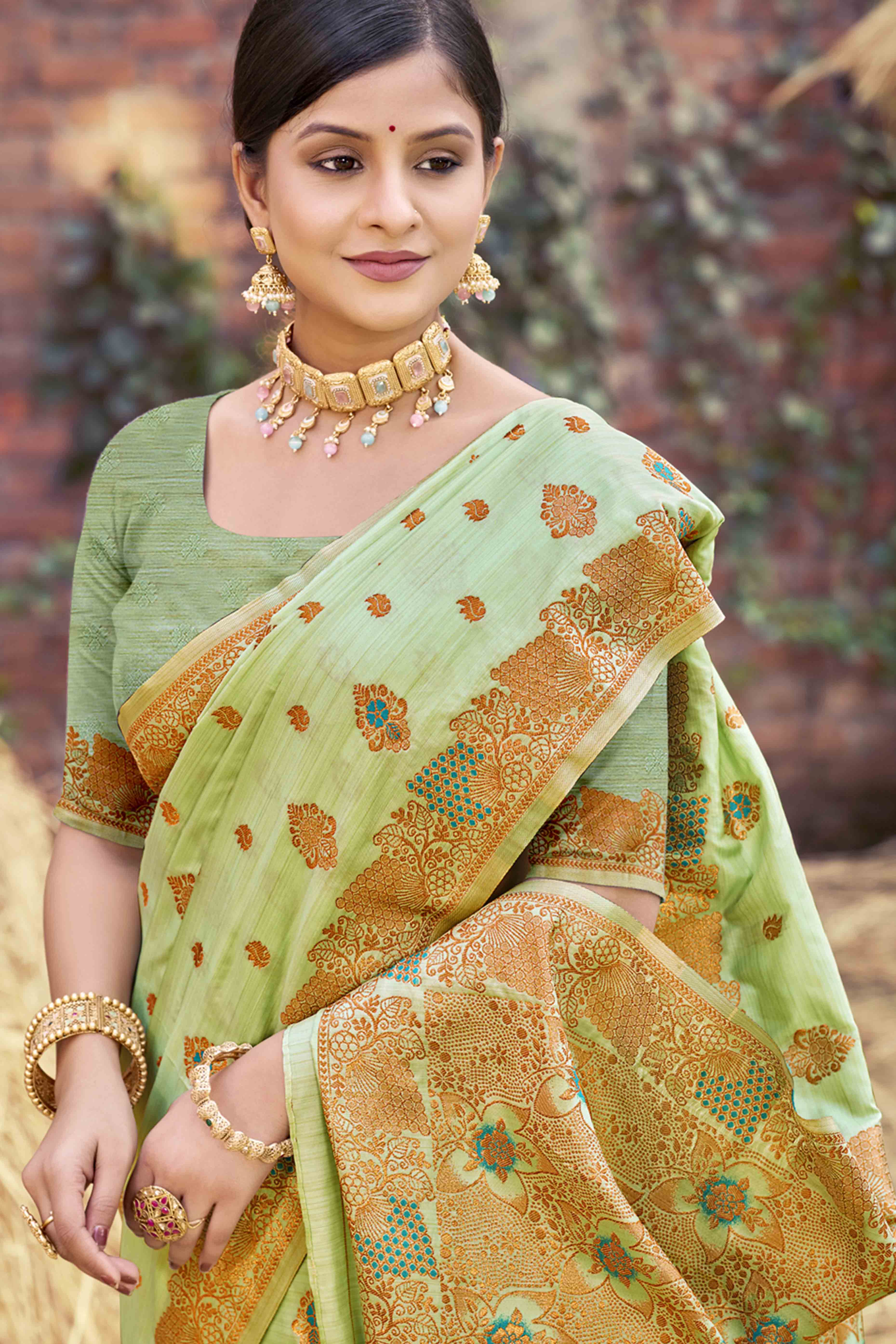 Green Banarasi Silk Saree Adorned With Woven Zari Floral Motifs