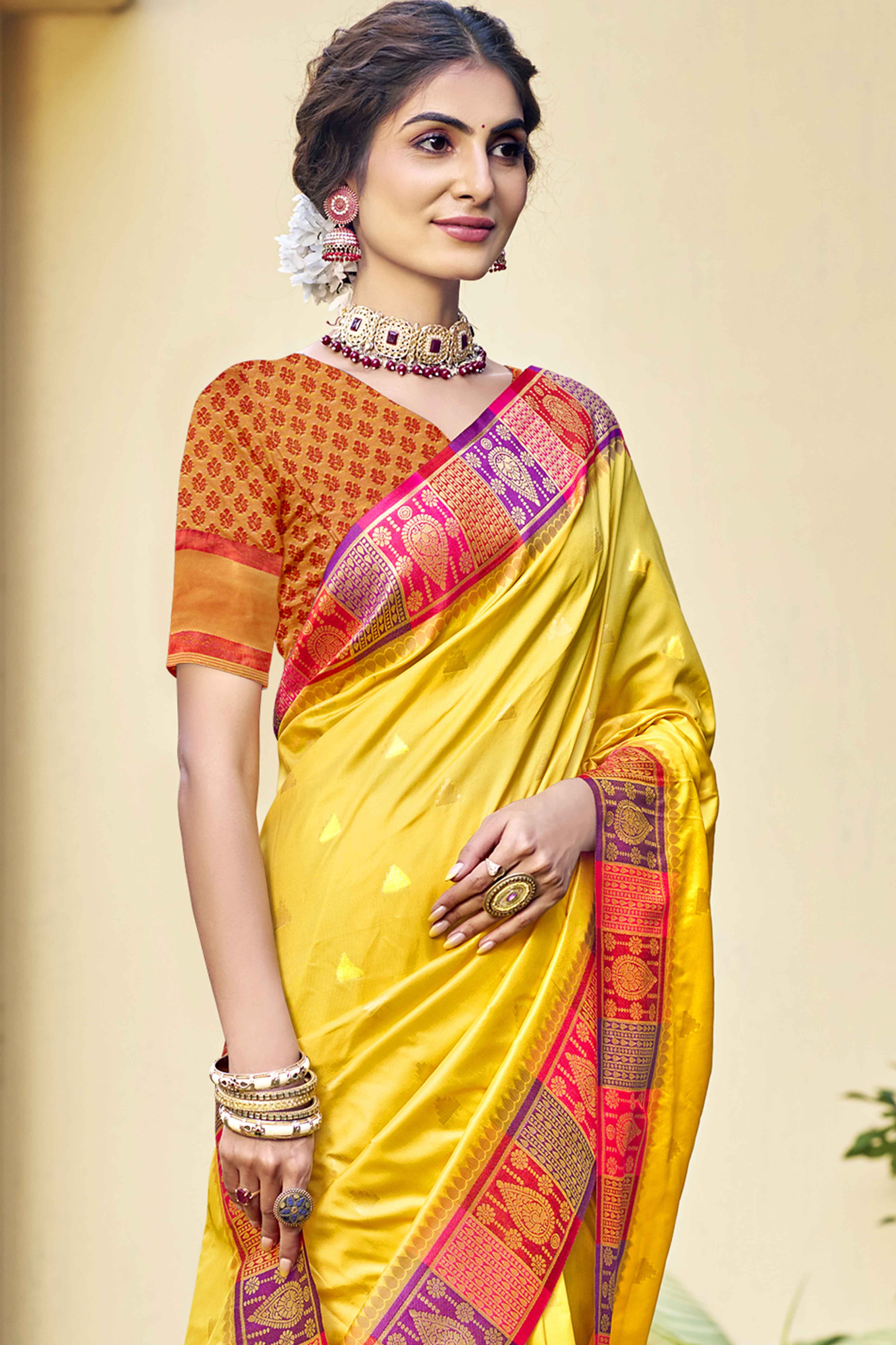 Yellow Woven Banarasi Silk Saree With Tassels