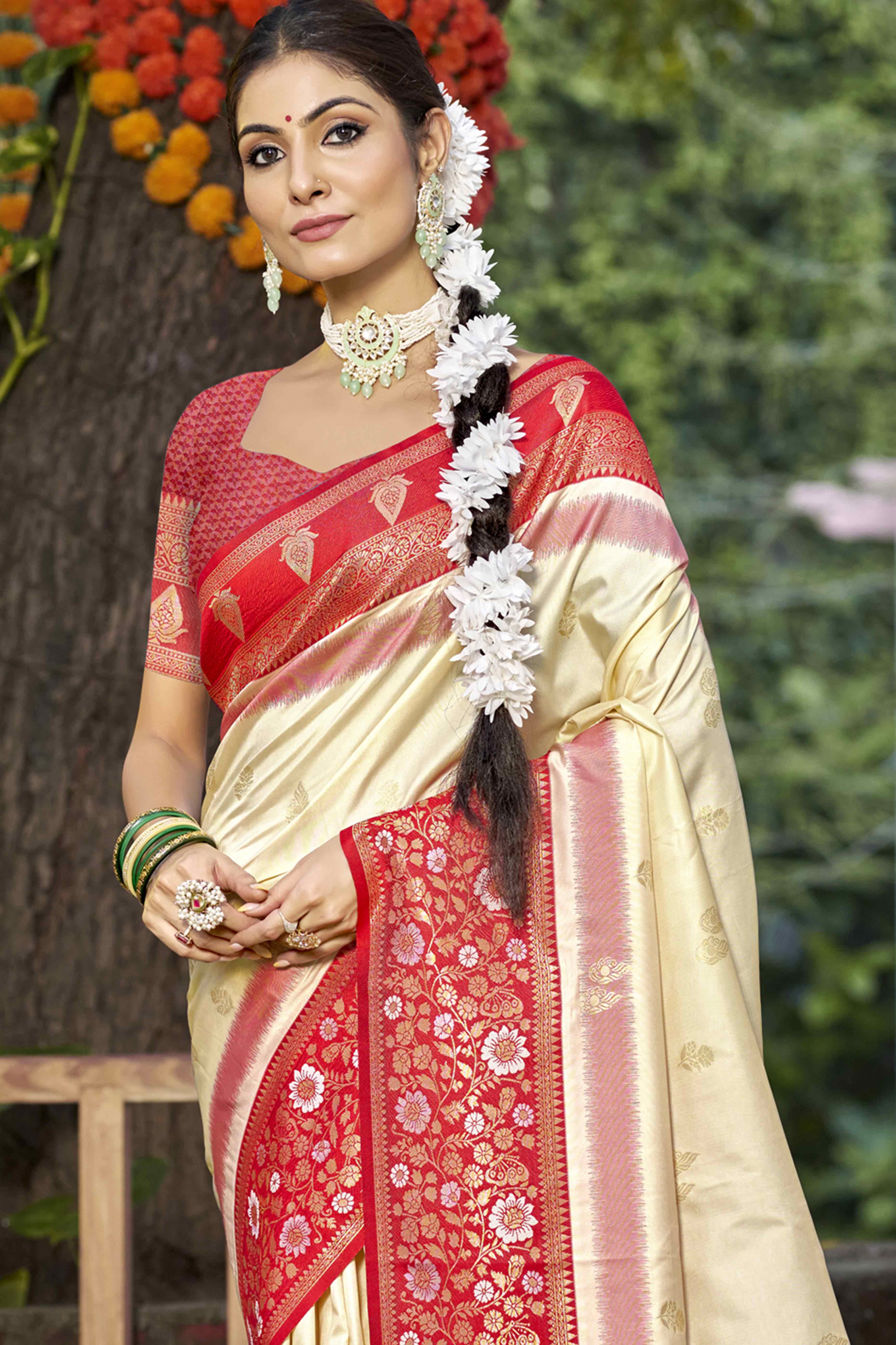 Cream Floral Woven Banarasi Silk Saree With Tassels