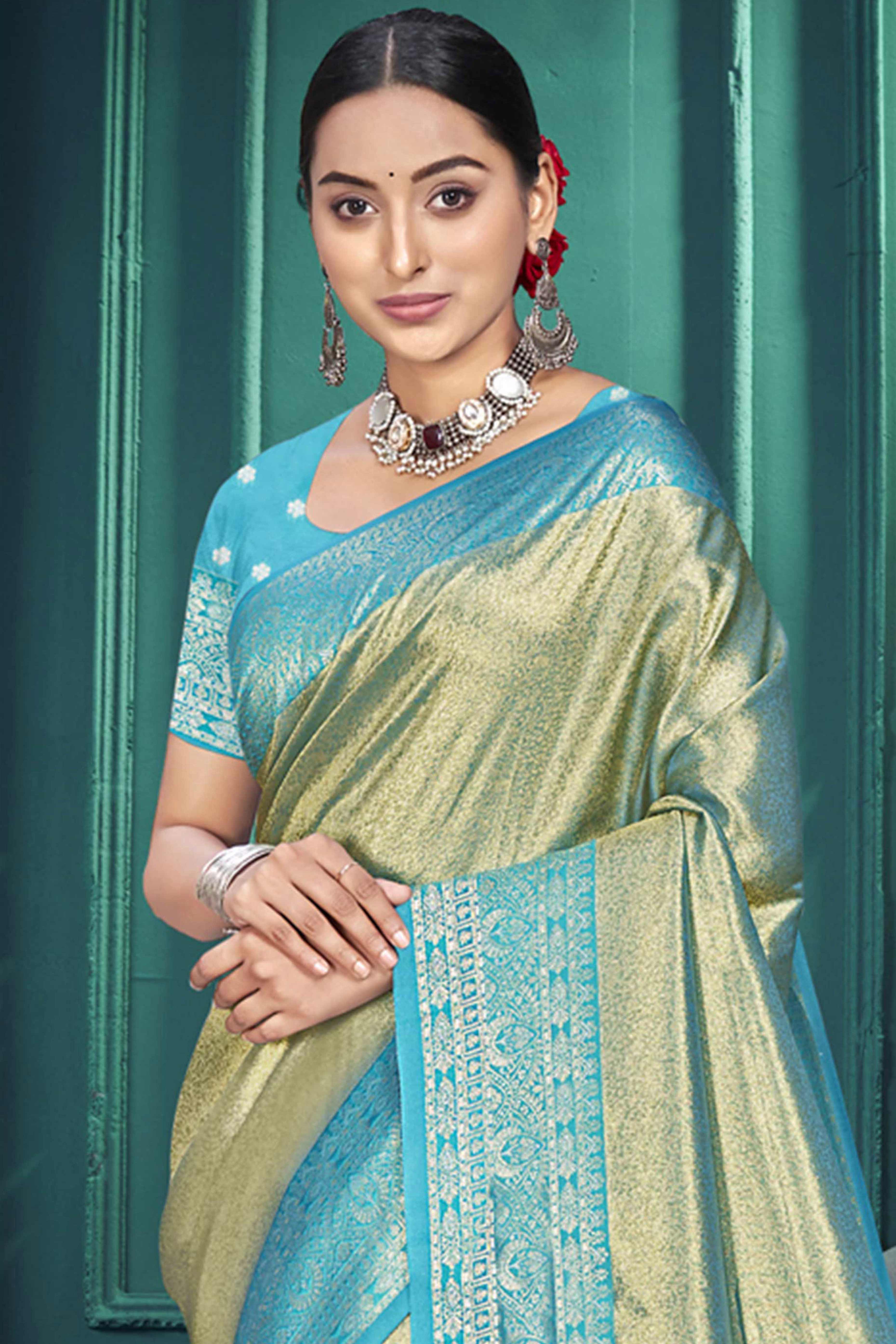 Exclusive Sage Green Floral Motif Woven Kanjivaram Silk Saree With Graceful Tassel Pallu