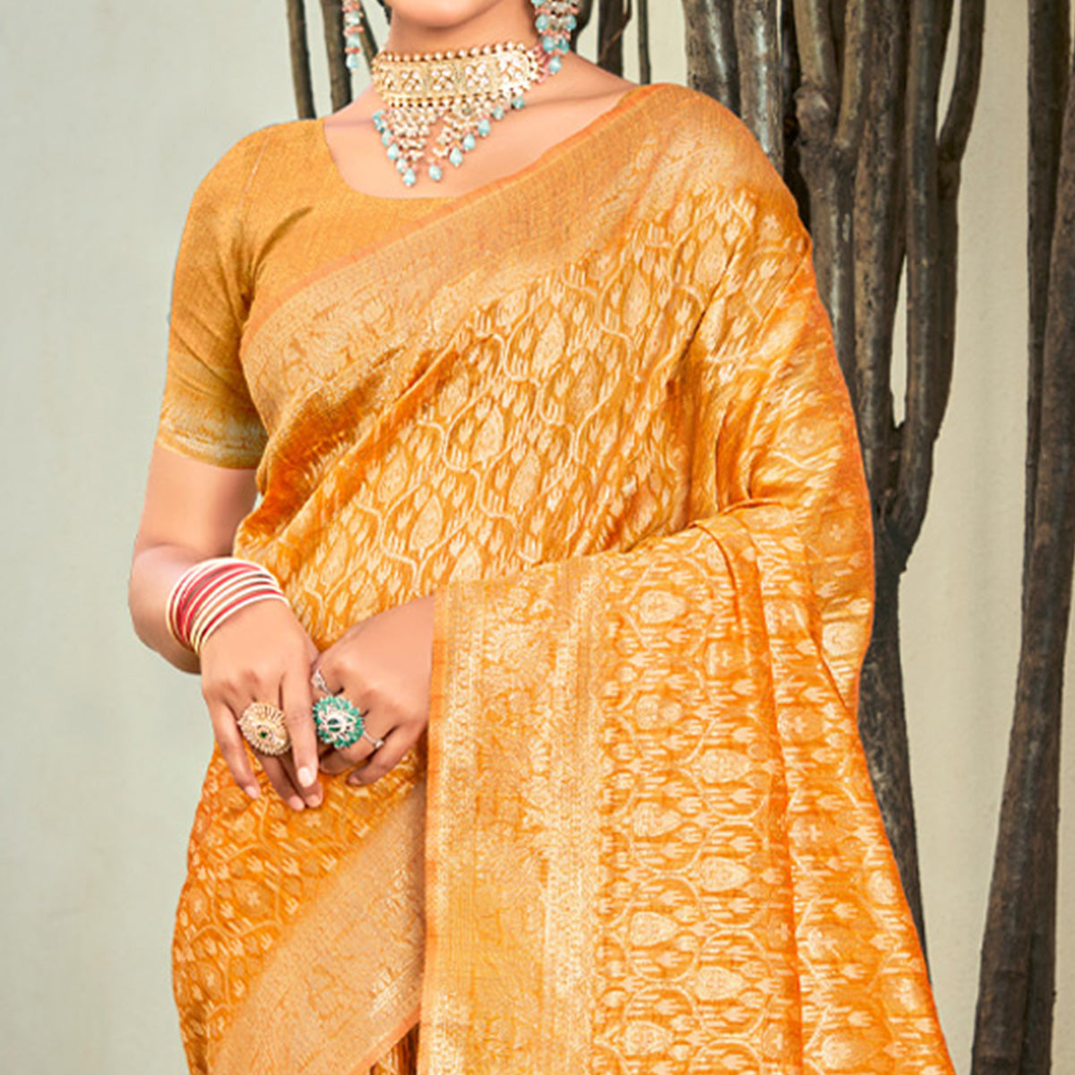 Mustard Floral Woven Cotton Blend Saree With Tassels