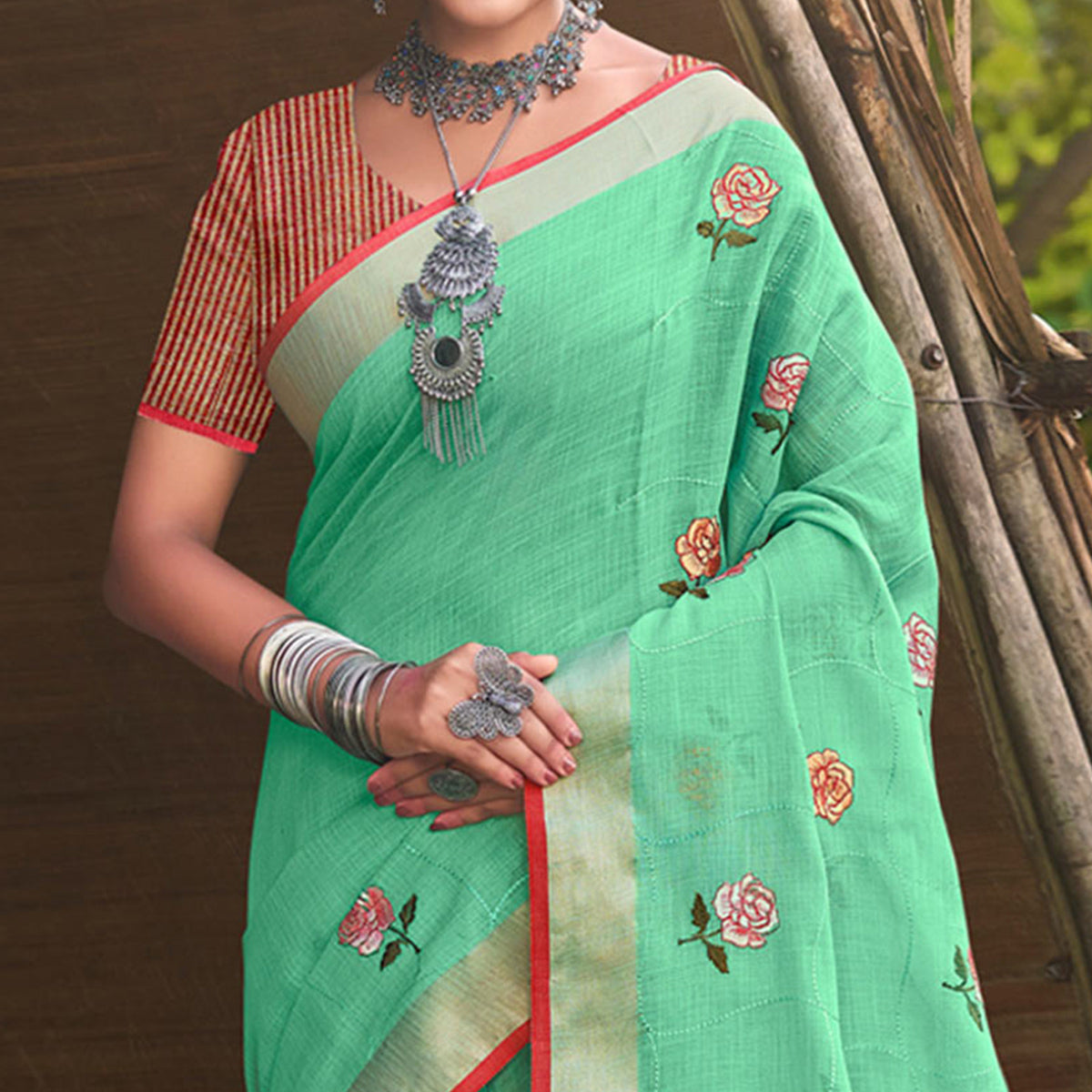 Sea Green Floral Embroidered Linen Saree With Tassels