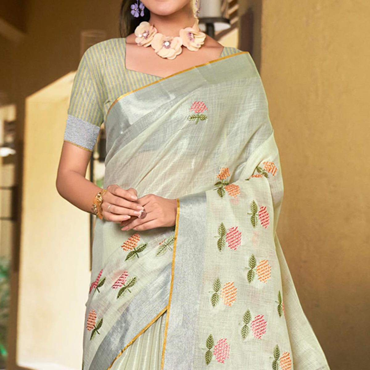 Pale Yellow Floral Embroidered Linen Saree With Tassels