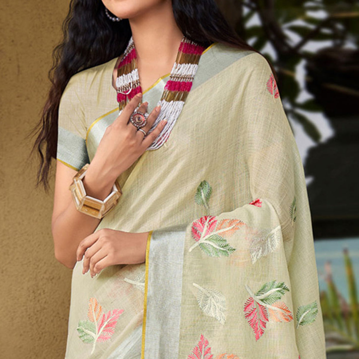 Pale Yellow Floral Embroidered Linen Saree With Tassels