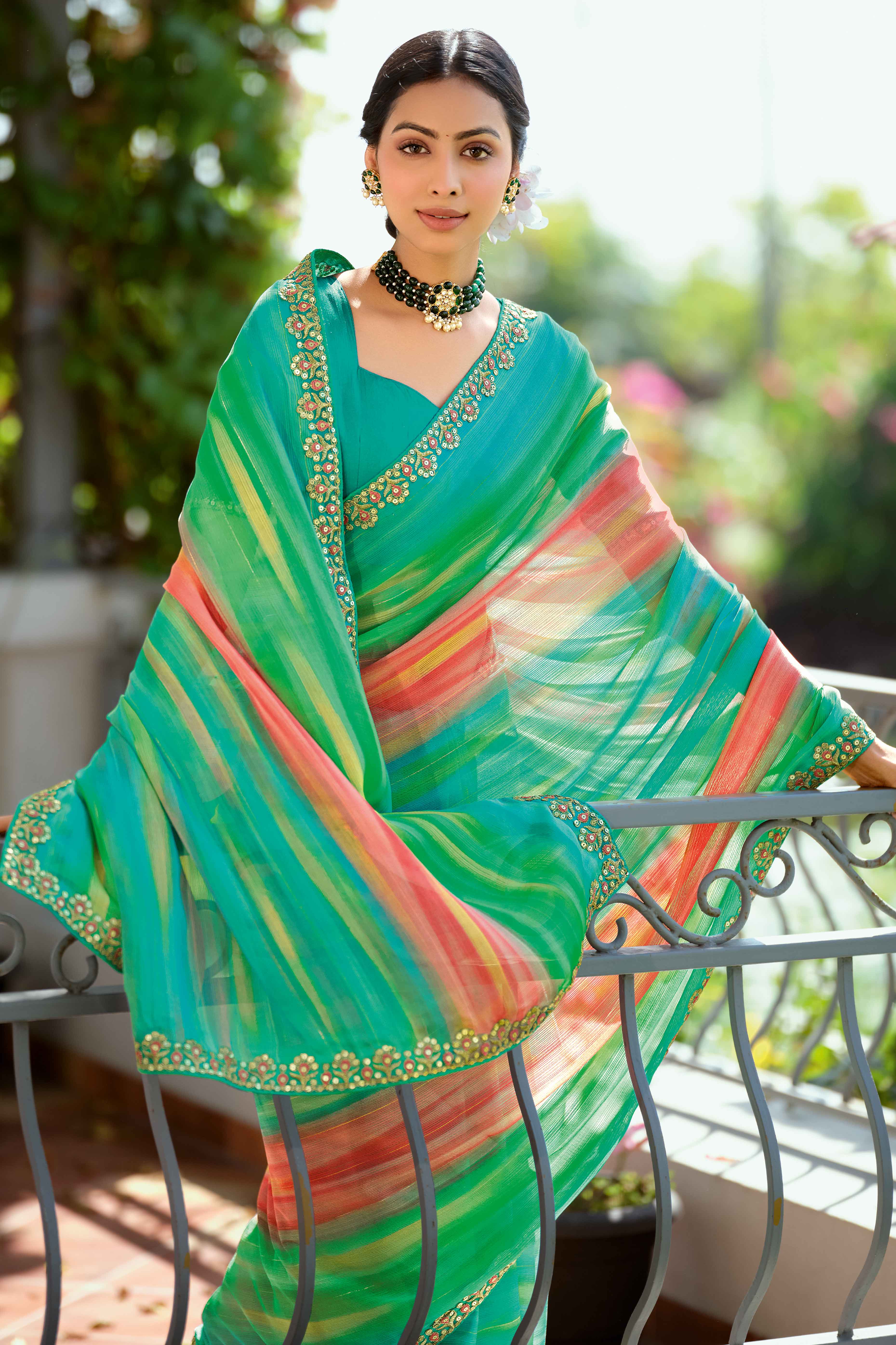 Festive Turquoise Georgette Saree with Dazzling Sequin Work Border
