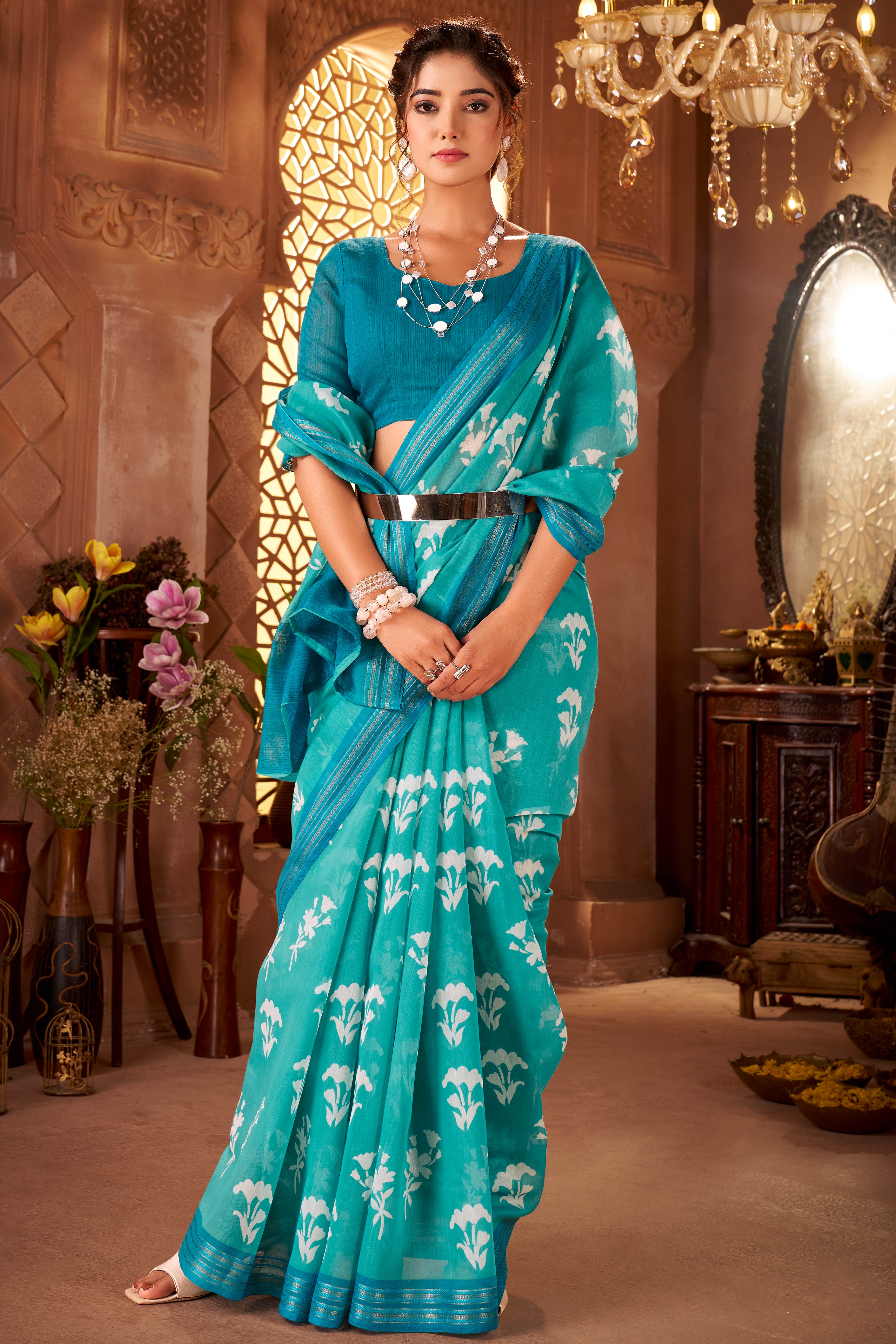 Sophisticated Turquoise Mulmul Cotton Saree Featuring Delicate Floral Prints & Weaving Border