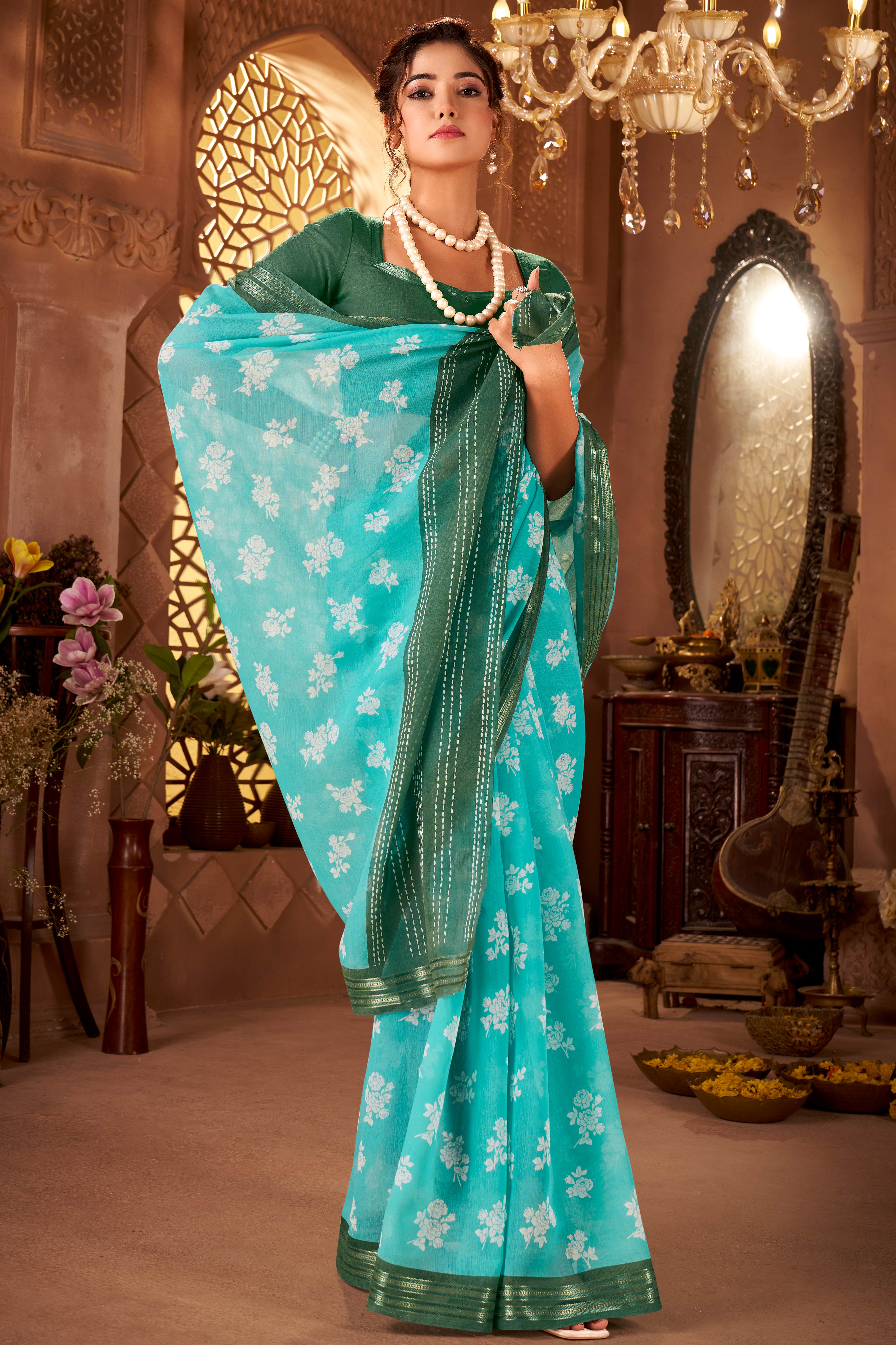 Sophisticated Turquoise Mulmul Cotton Saree Featuring Delicate Floral Prints & Weaving Border