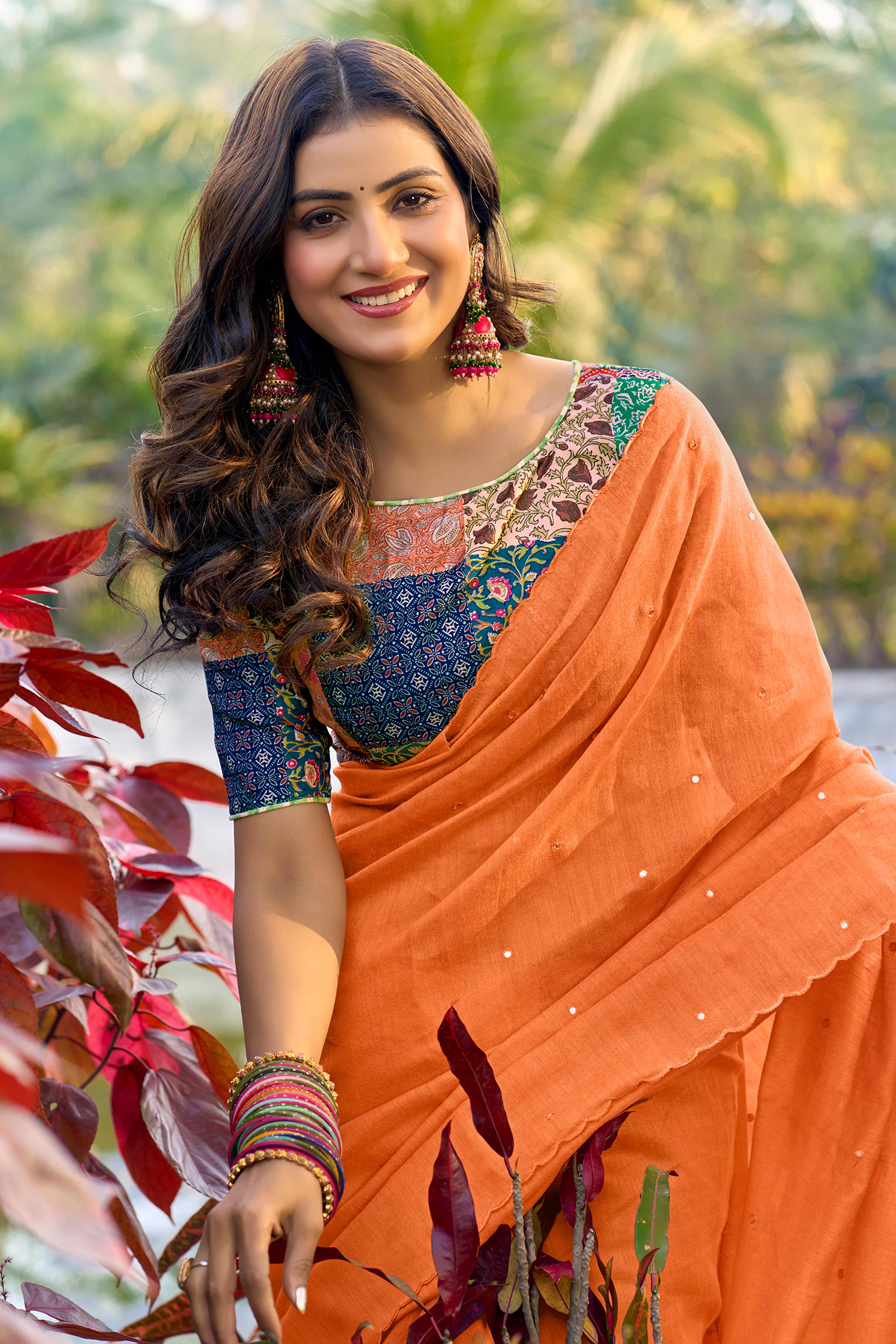 Timeless Orange Cotton Blend Drape Highlighted With Shimmering Mirror Embroidery Work