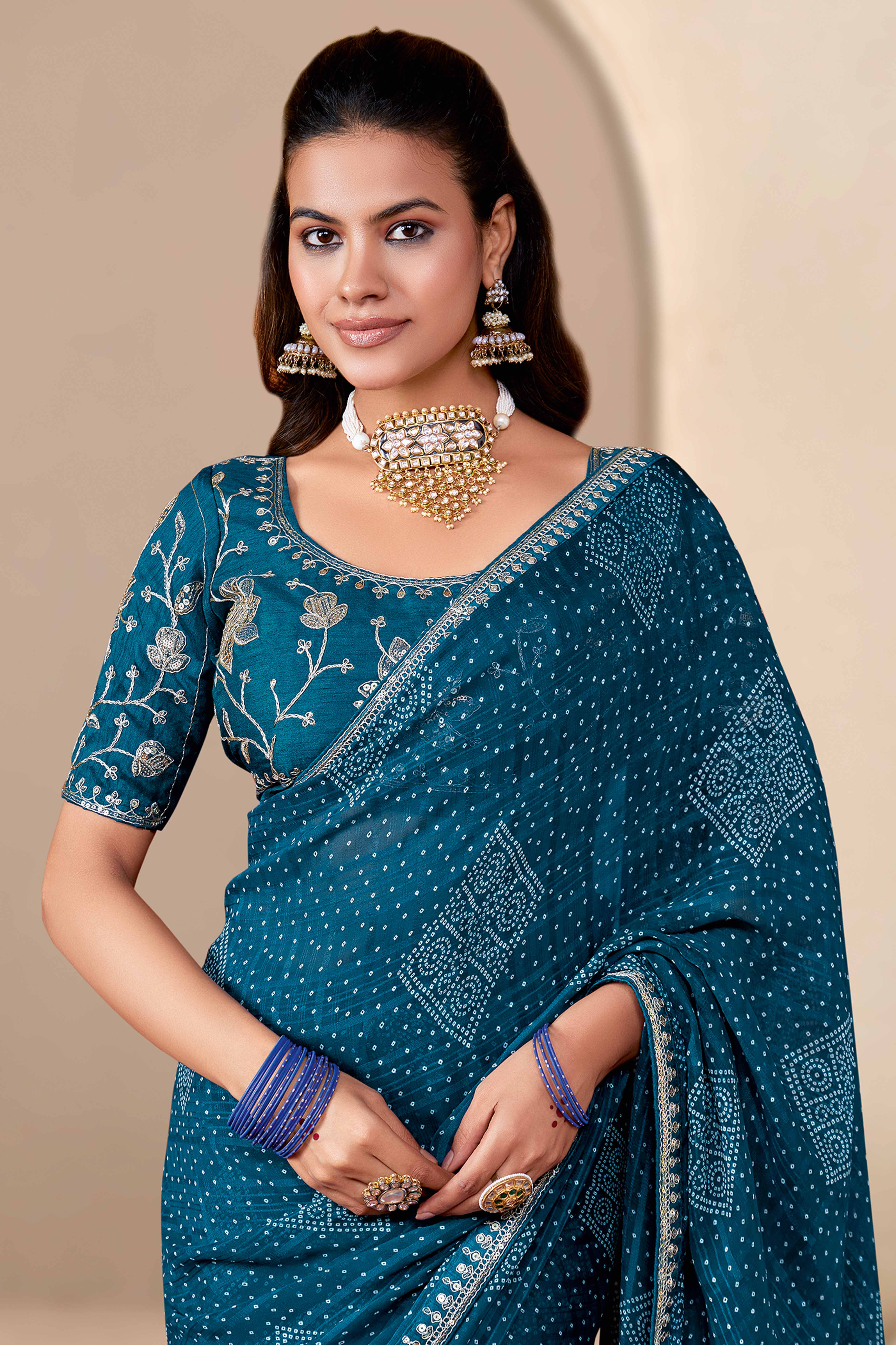 Teal Blue Bandhani Printed Georgette Saree Enhanced With Sequins & Cording Embroidered Lace Border