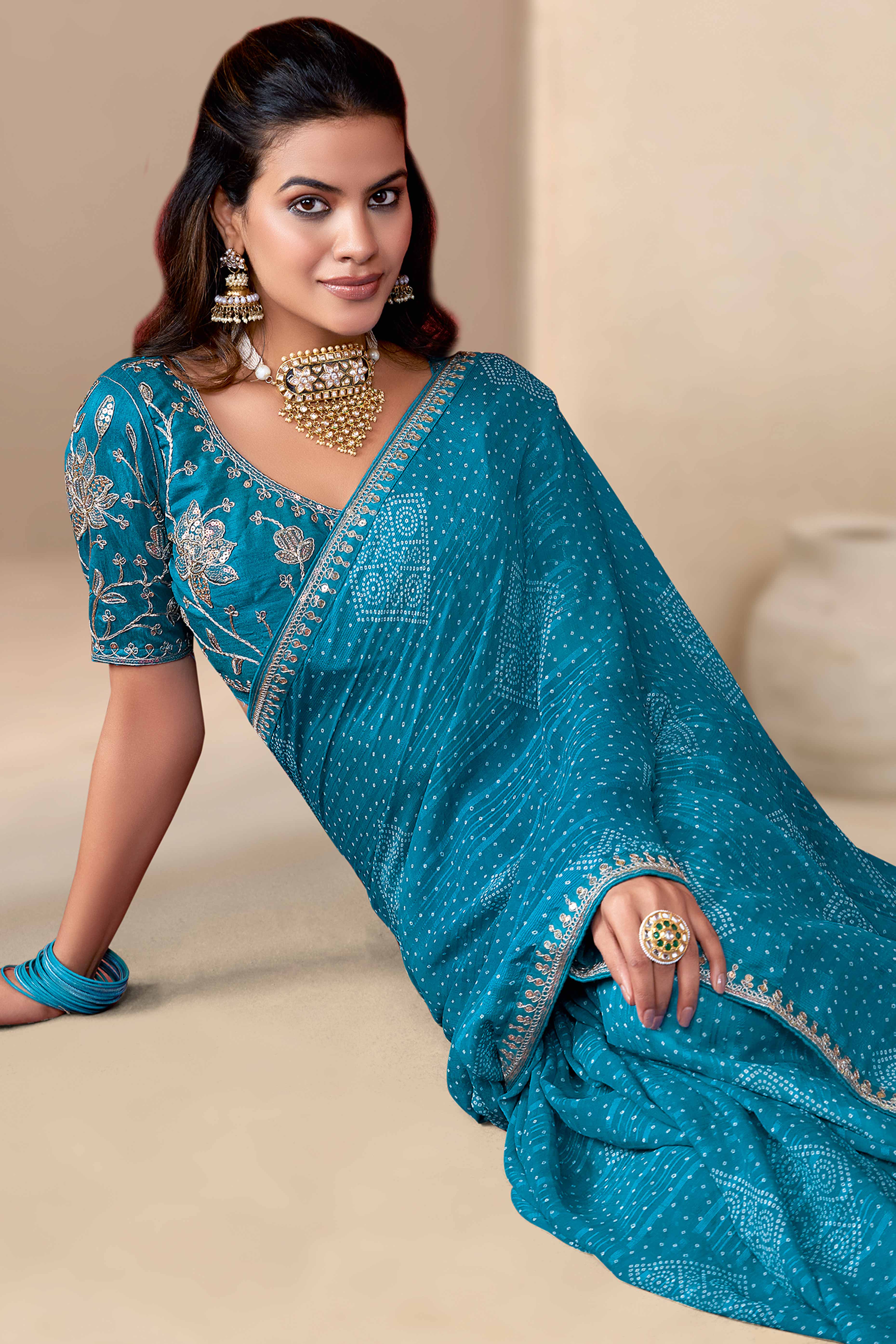 Blue Bandhani Printed Georgette Saree Enhanced With Sequins & Cording Embroidered Lace Border