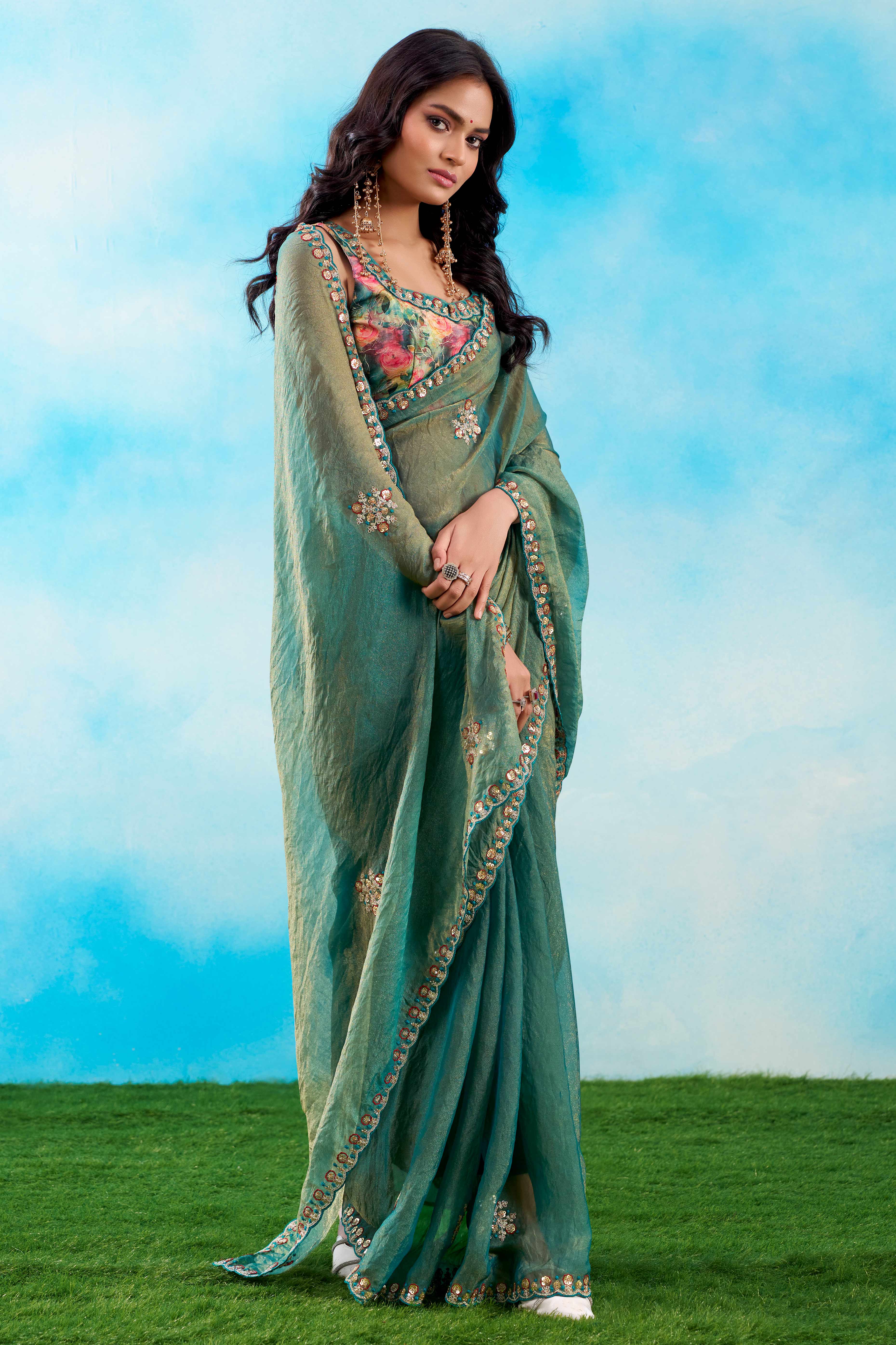 Luxurious Teal Chiffon Saree Showcasing Floral Sequins Embroidery In A Two Tone Finish