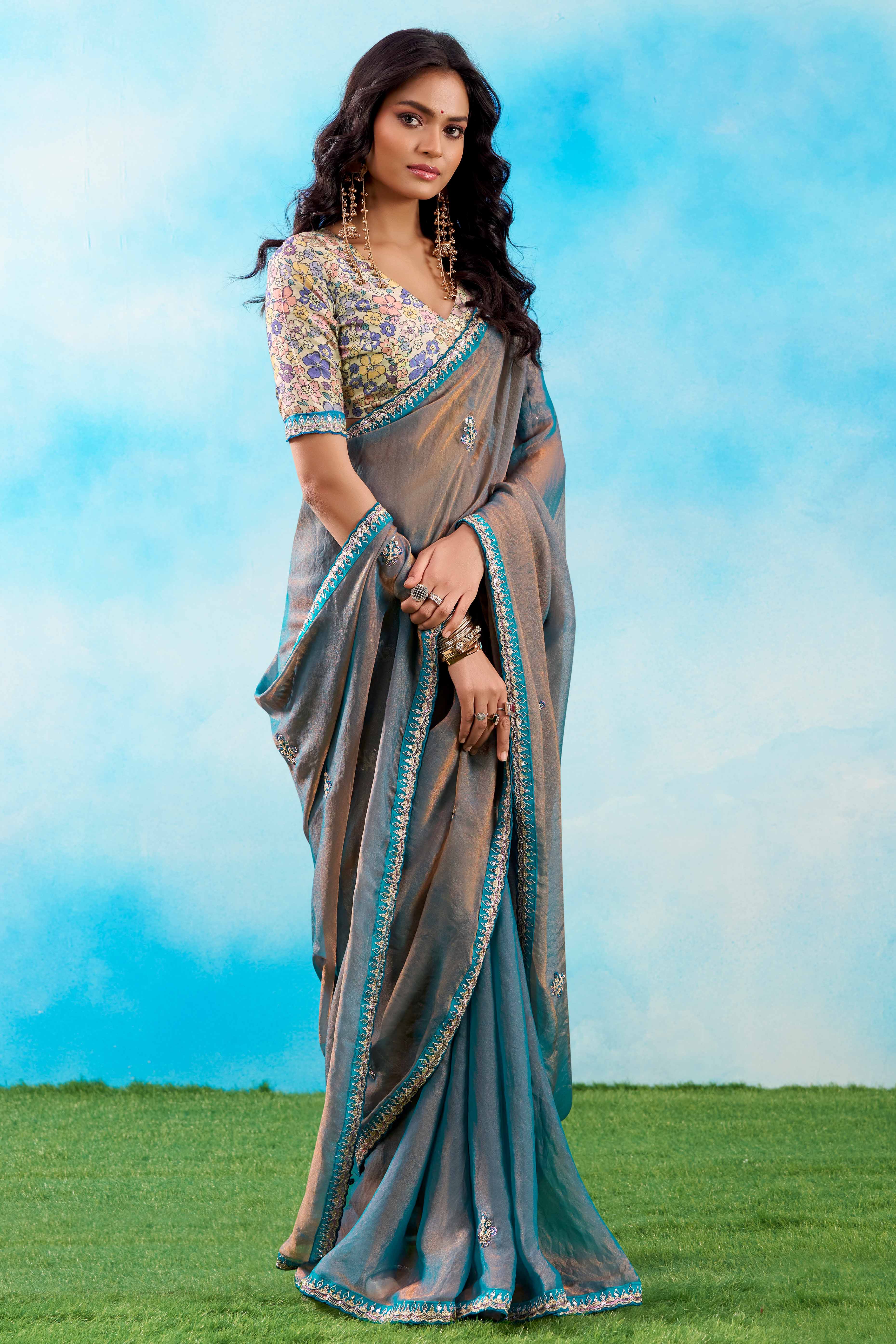 Luxurious Blue Chiffon Saree Showcasing Floral Sequins Embroidery In A Two Tone Finish
