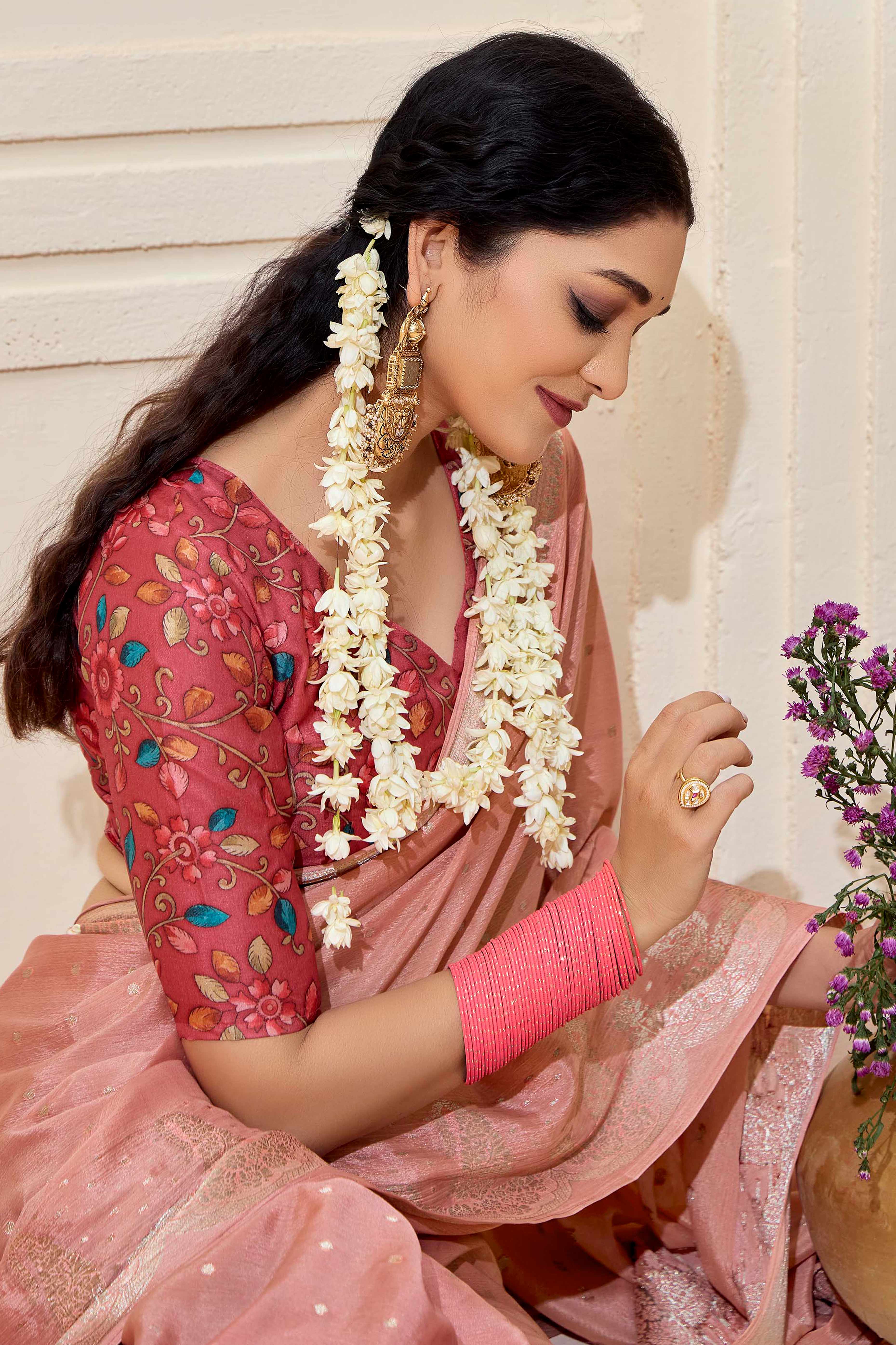 Peach Chinon Saree with Jacquard Weaving and Delicate Tassel Accents