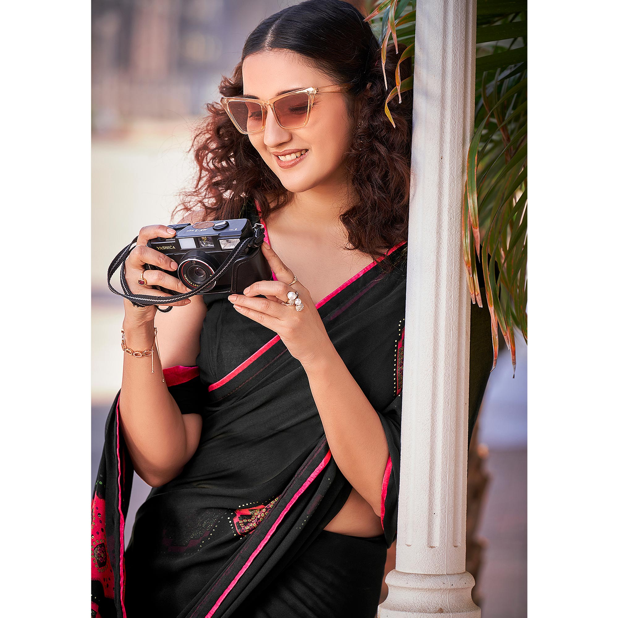 Black Foil Printed Georgette Saree With Tassels