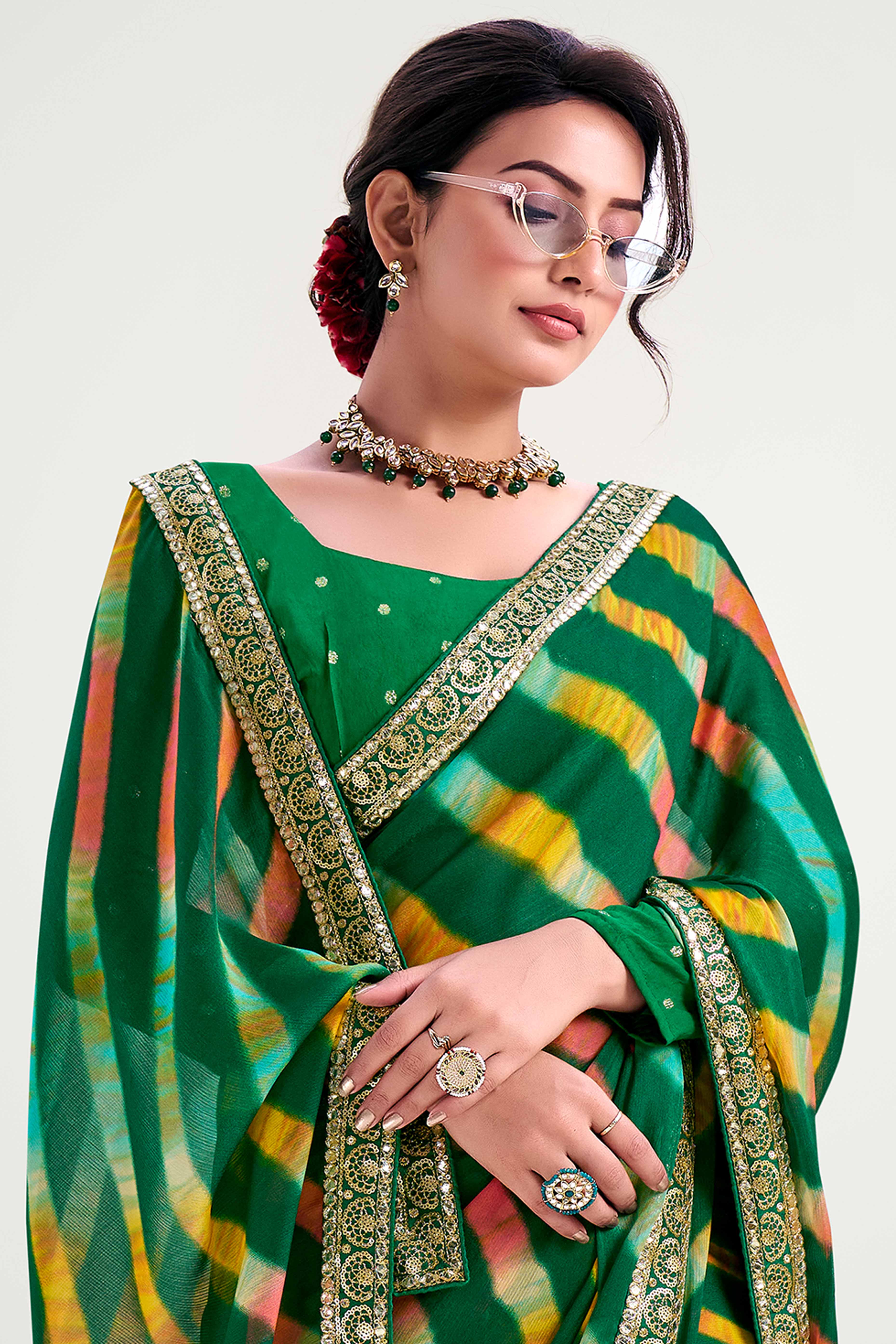 Green Striped Printed Chiffon Saree Enhanced With Sparkling Sequins Embroidered Border Work