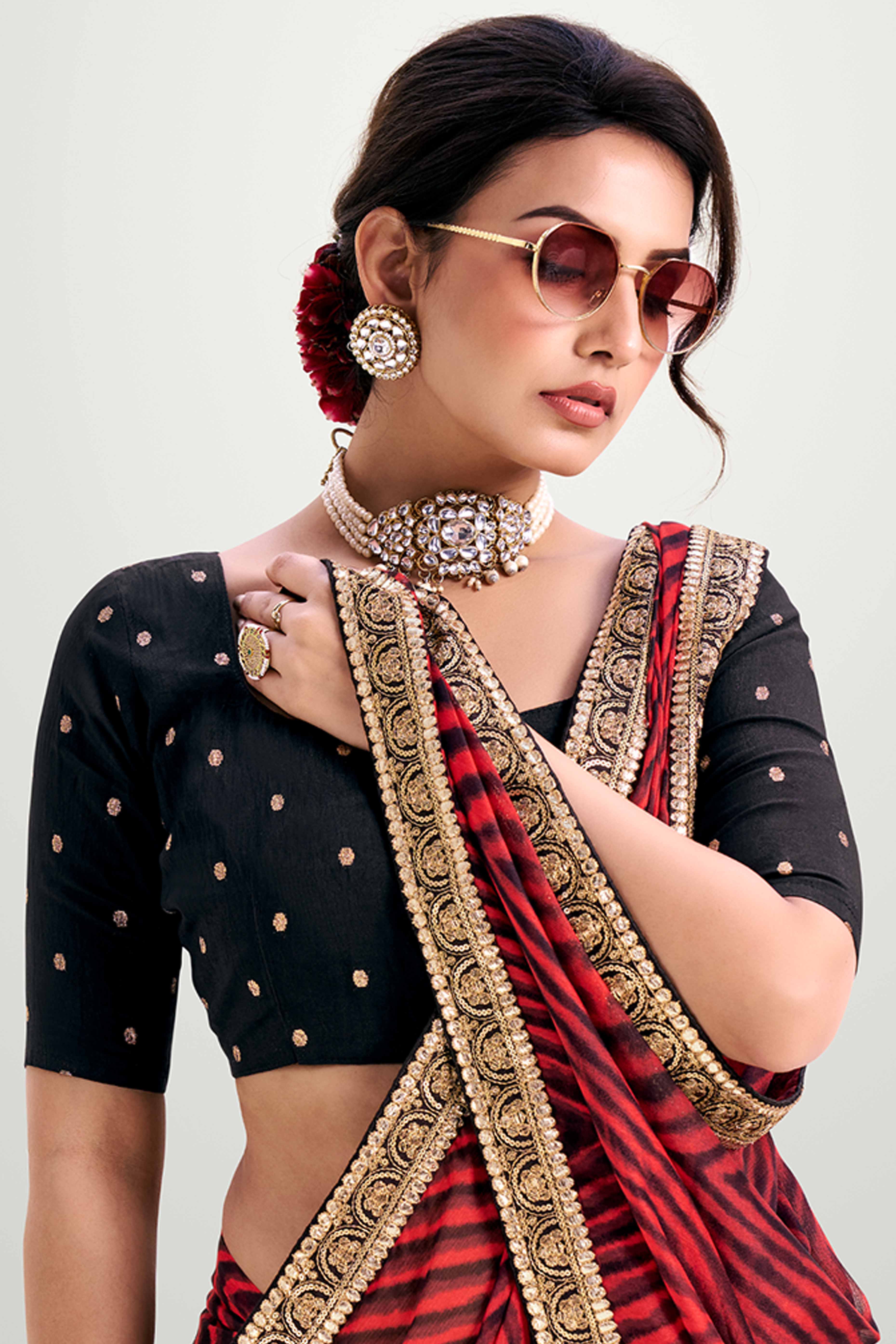 Red Striped Printed Chiffon Saree Enhanced With Sparkling Sequins Embroidered Border Work