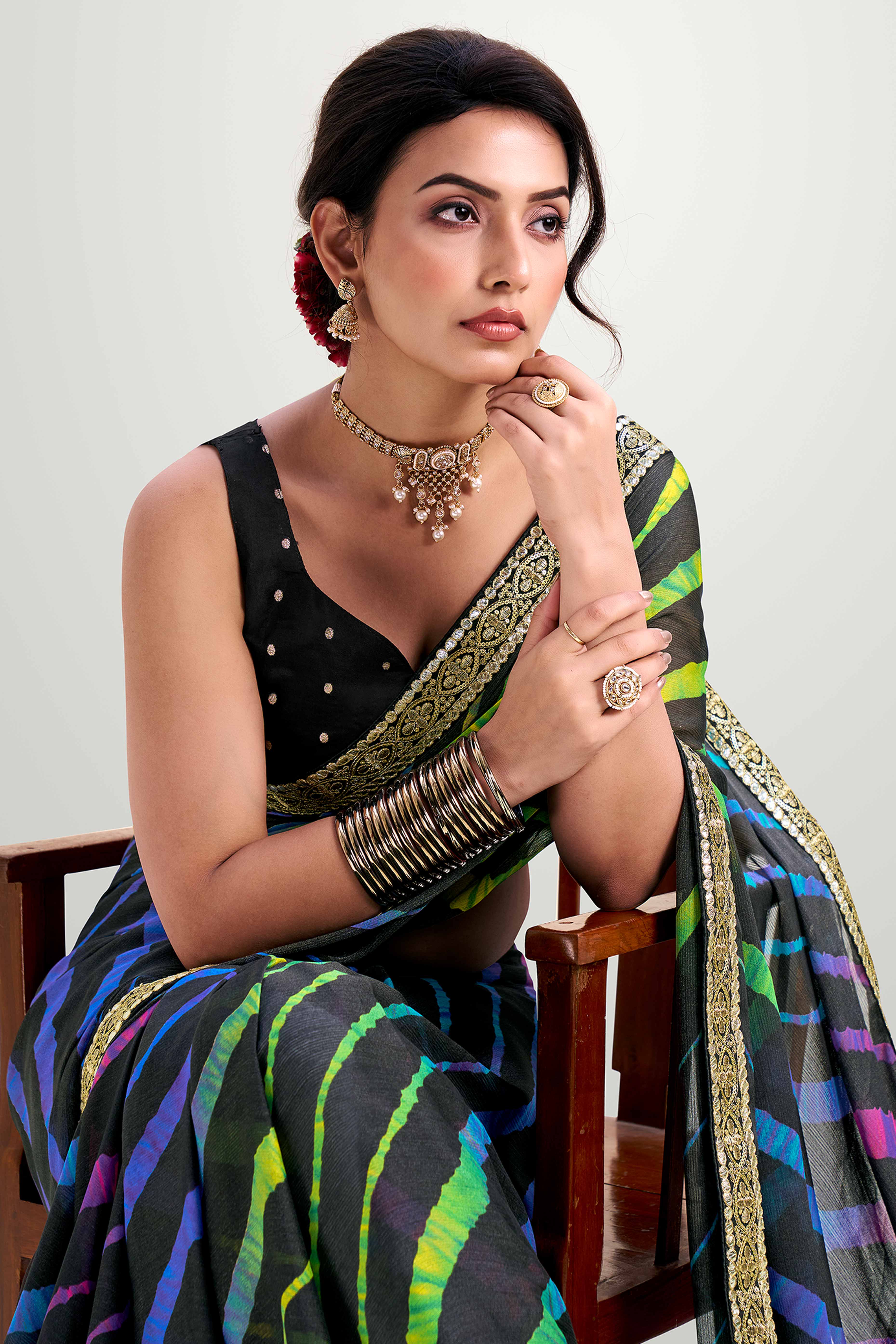 Black Striped Printed Chiffon Saree Enhanced With Sparkling Sequins Embroidered Border Work