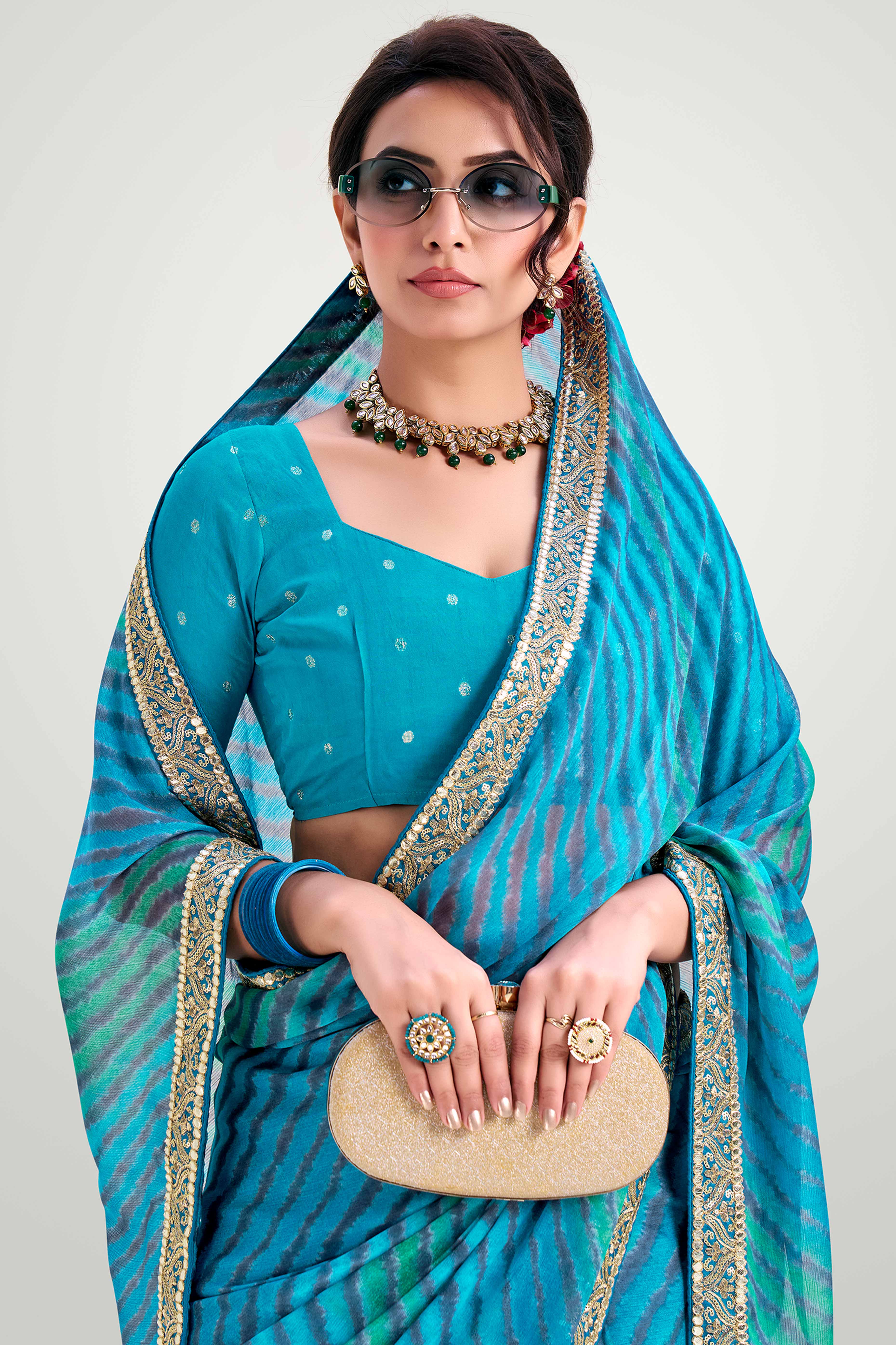 Blue Striped Printed Chiffon Saree Enhanced With Sparkling Sequins Embroidered Border Work