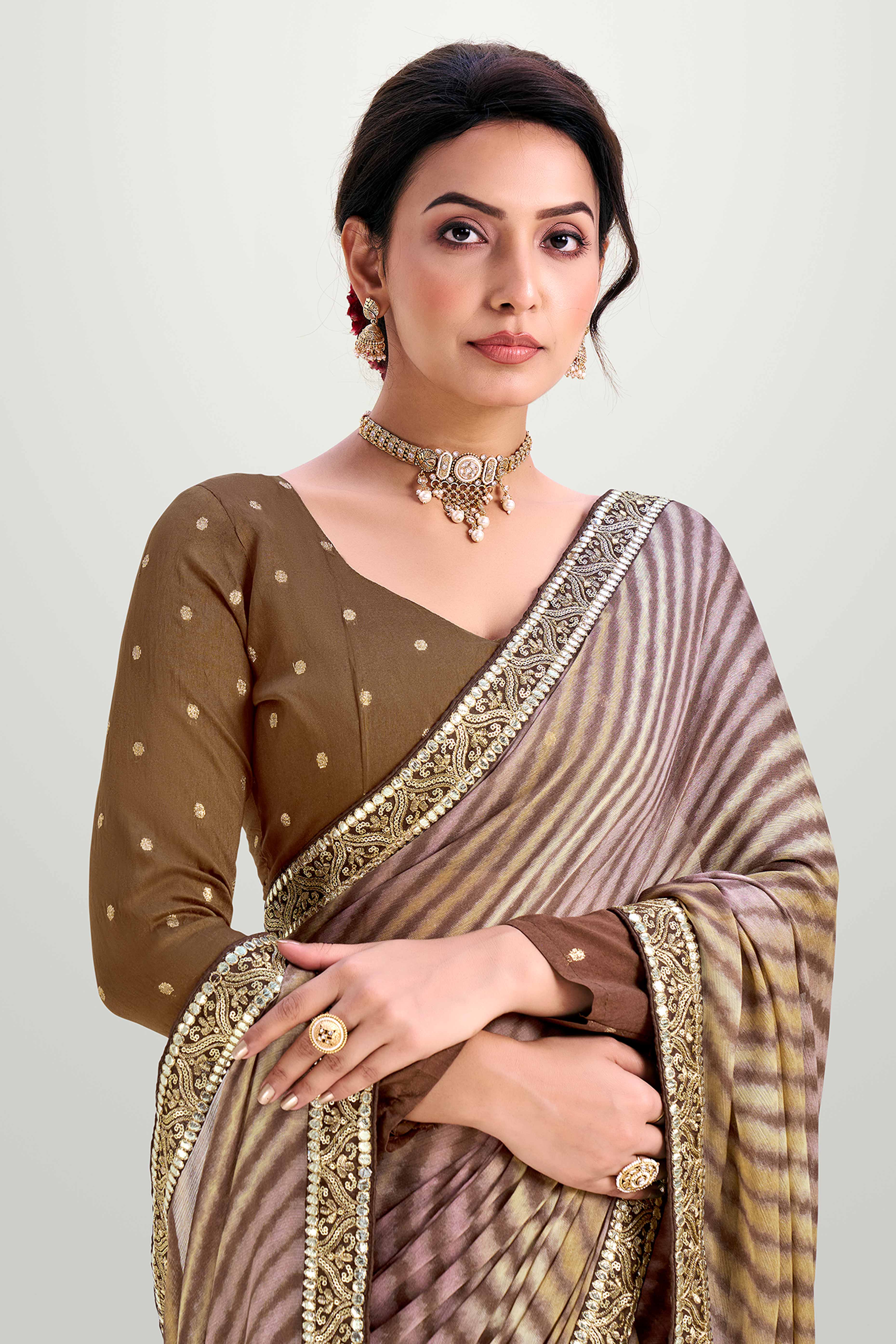 Brown Striped Printed Chiffon Saree Enhanced With Sparkling Sequins Embroidered Border Work
