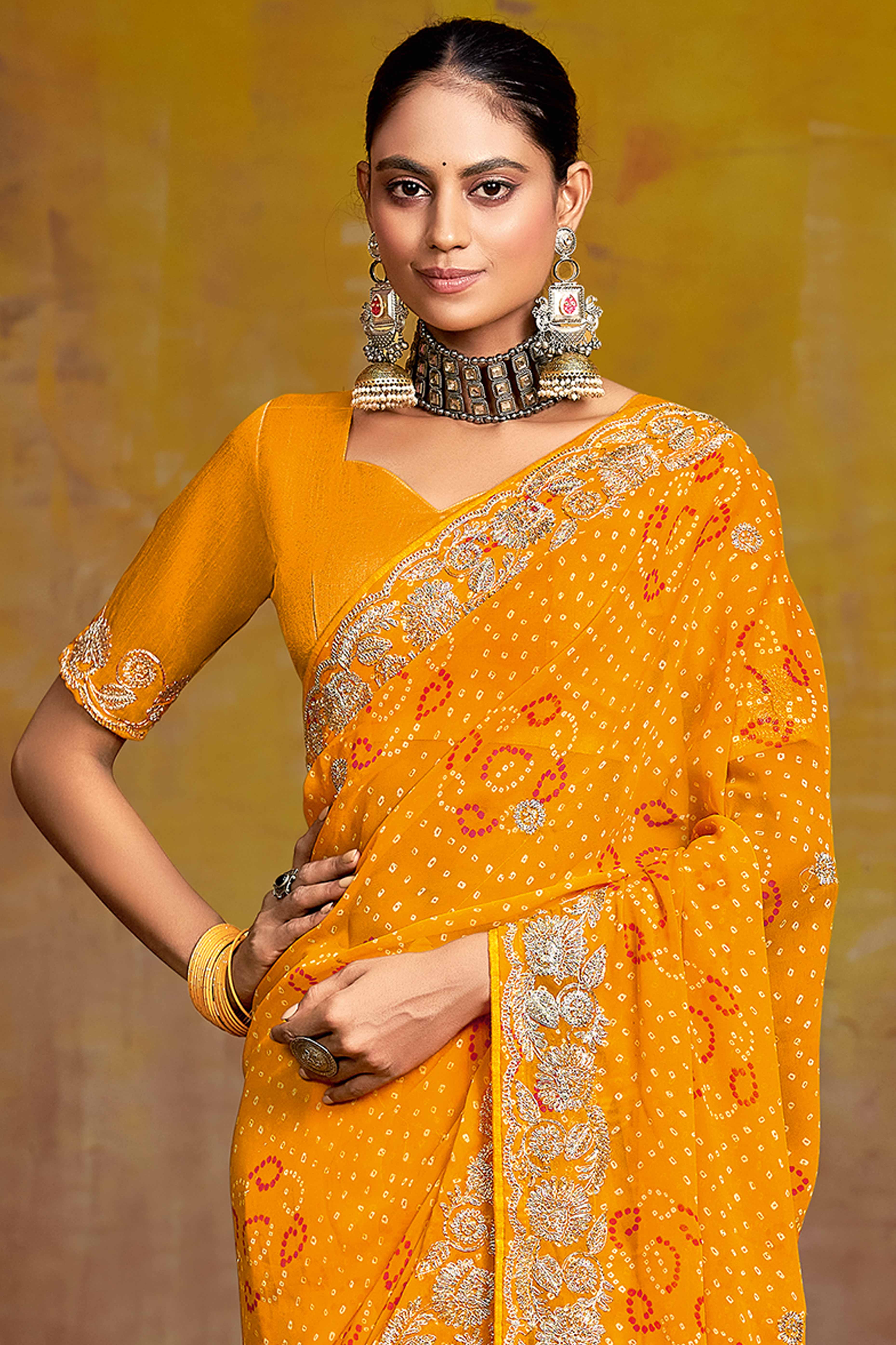Mustard Georgette Saree Adorned With Traditional Bandhani Prints & Intricate Floral Embroidery