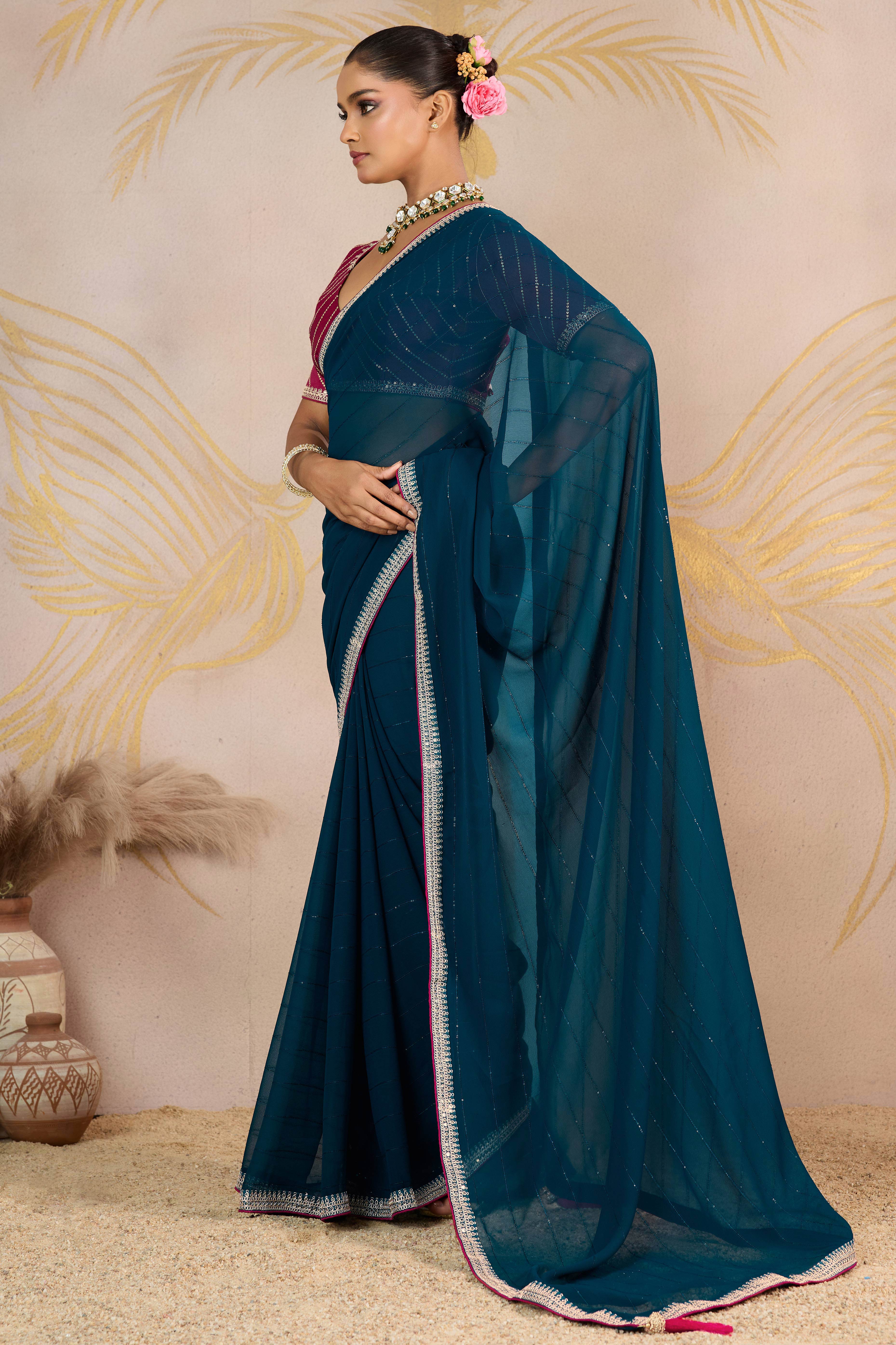 Teal Zari Embroidered Georgette Saree Accented With Sequins