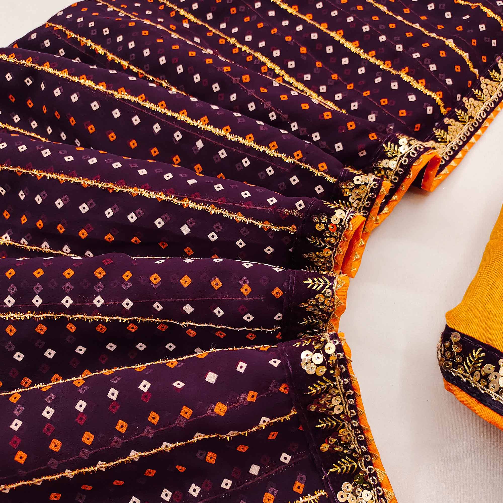 Charming Wine Bandhani Printed Georgette Saree With Glittering Sequins & Zari Border