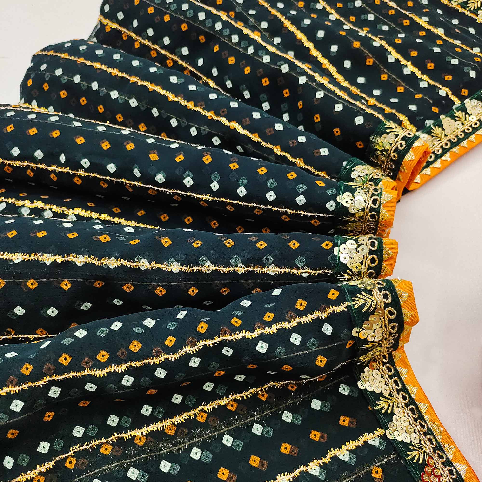 Charming Dark Teal Green Bandhani Printed Georgette Saree With Glittering Sequins & Zari Border