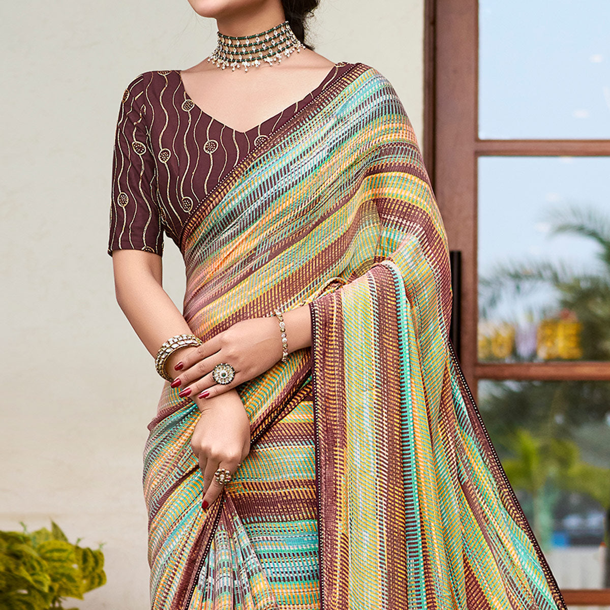 Brown Printed Chiffon Saree With Tassels