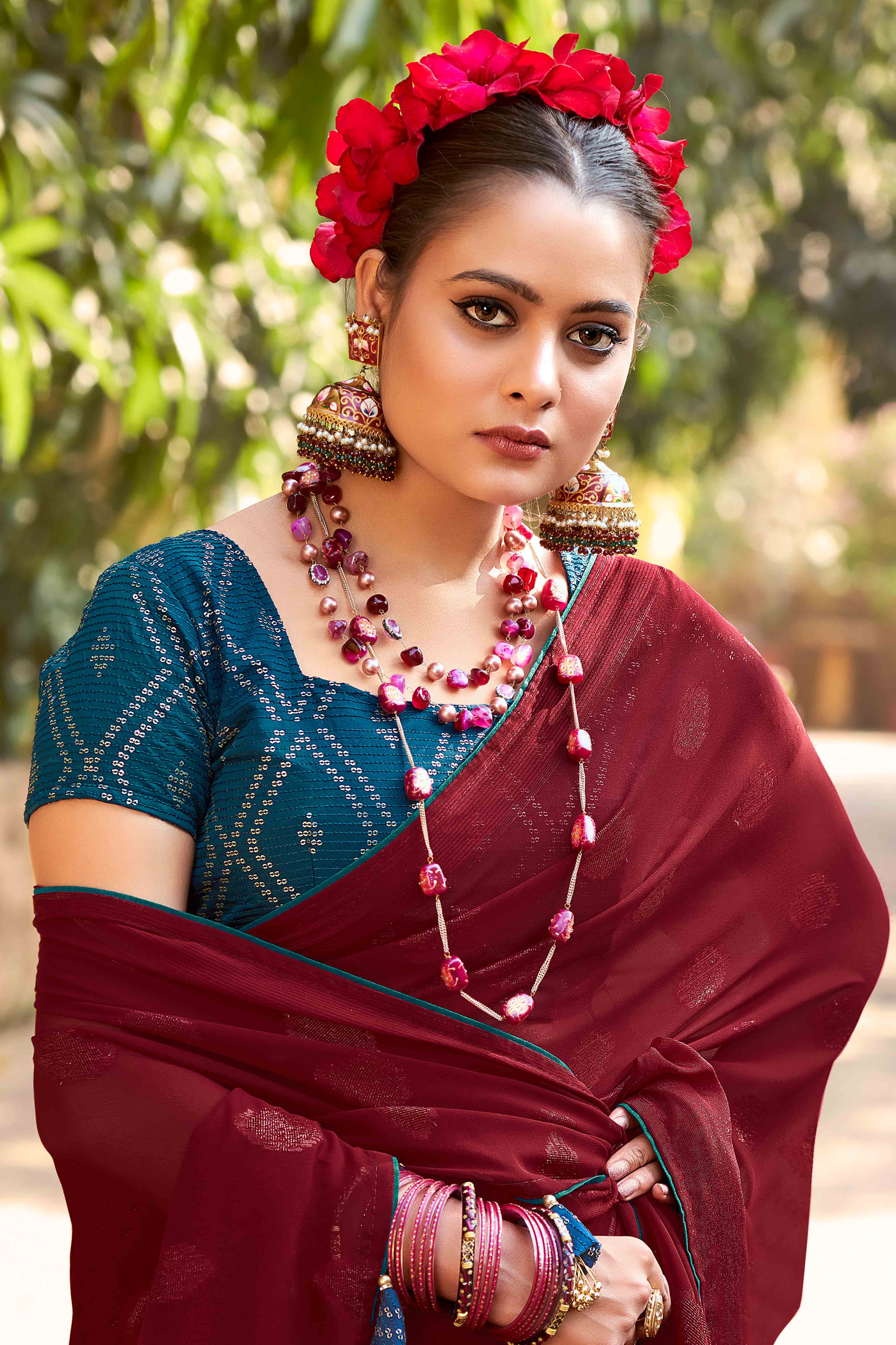 Maroon Woven Georgette Saree With Tassels