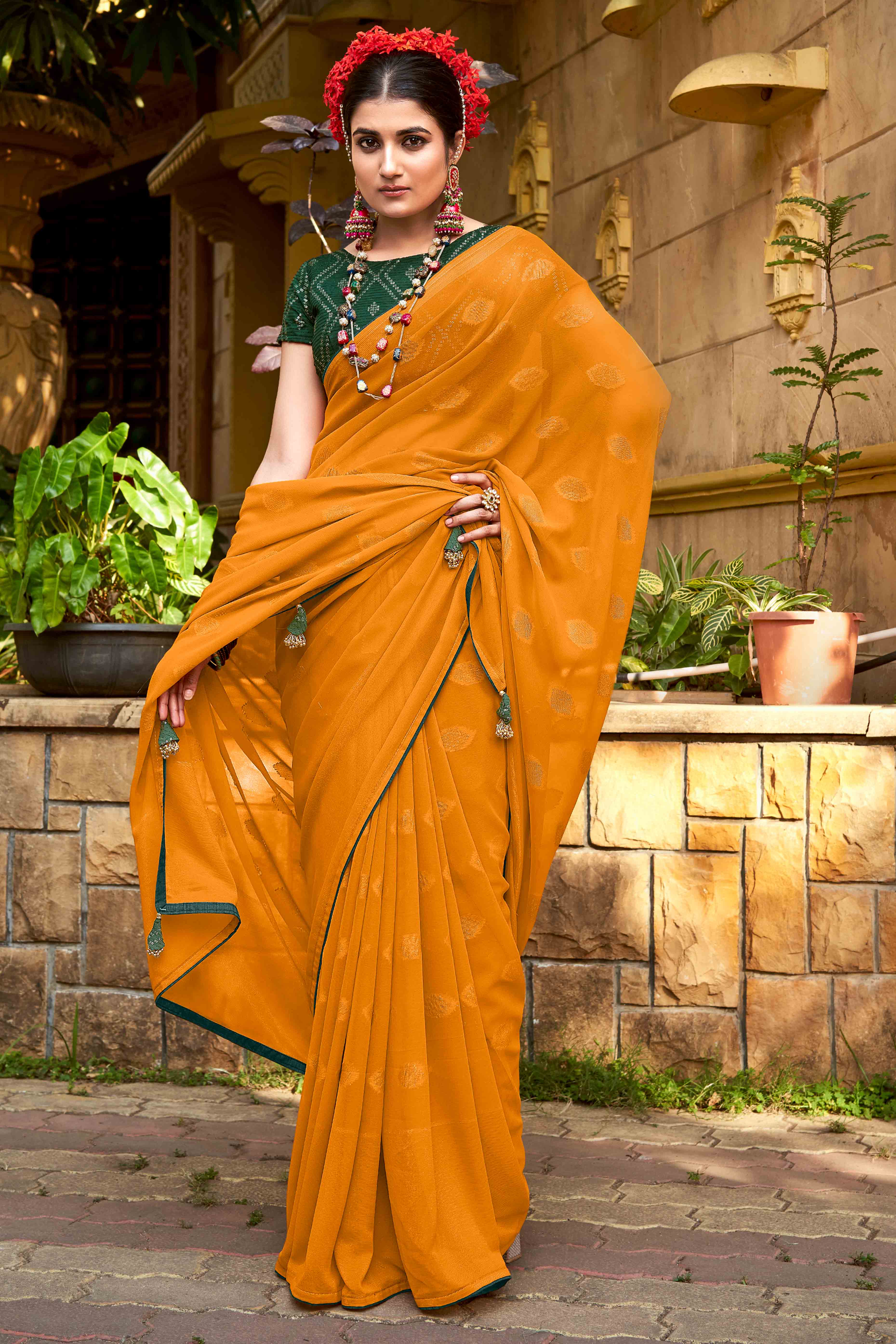 Mustard Woven Georgette Saree With Tassels