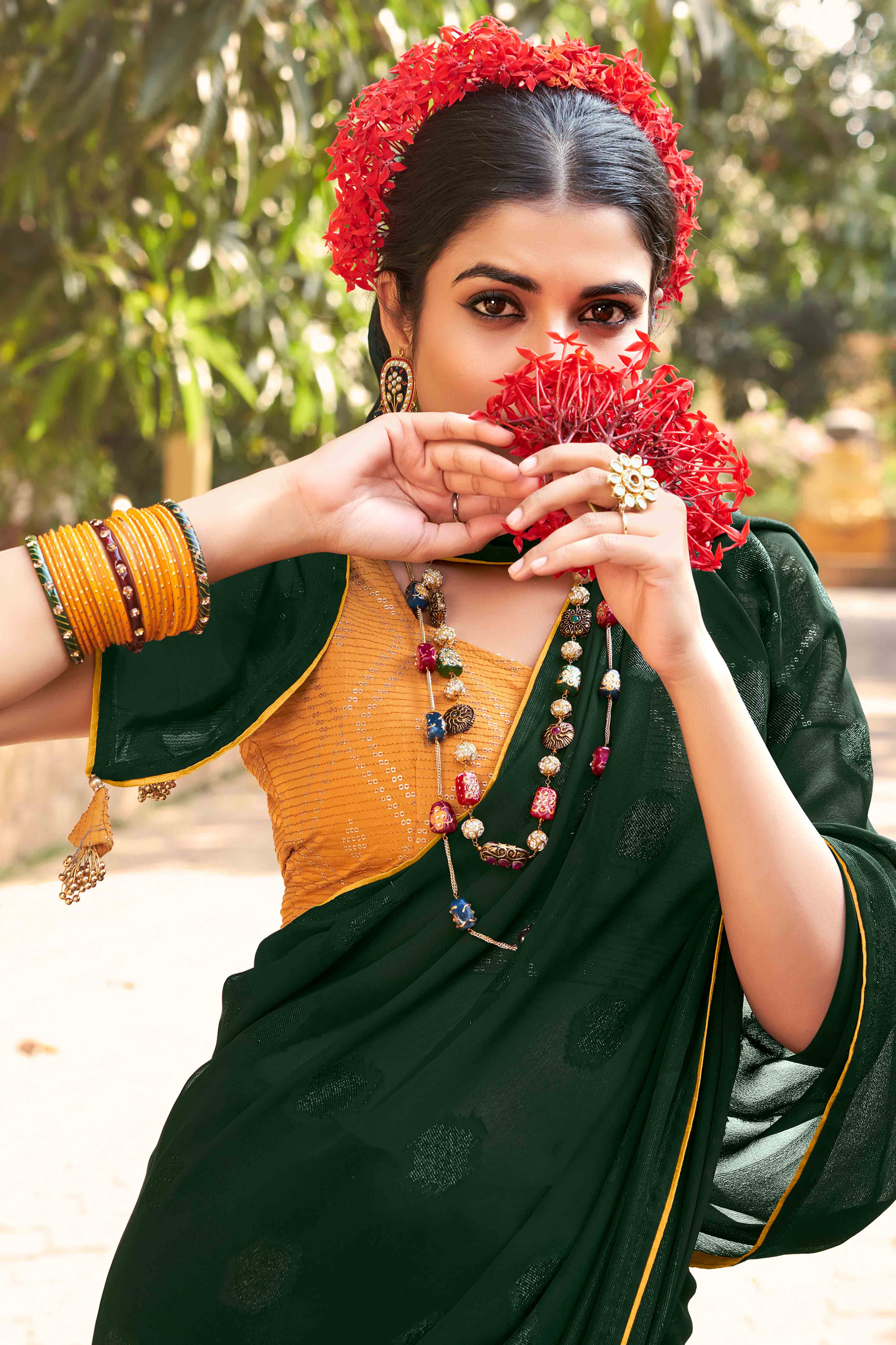 Green Woven Georgette Saree With Tassels