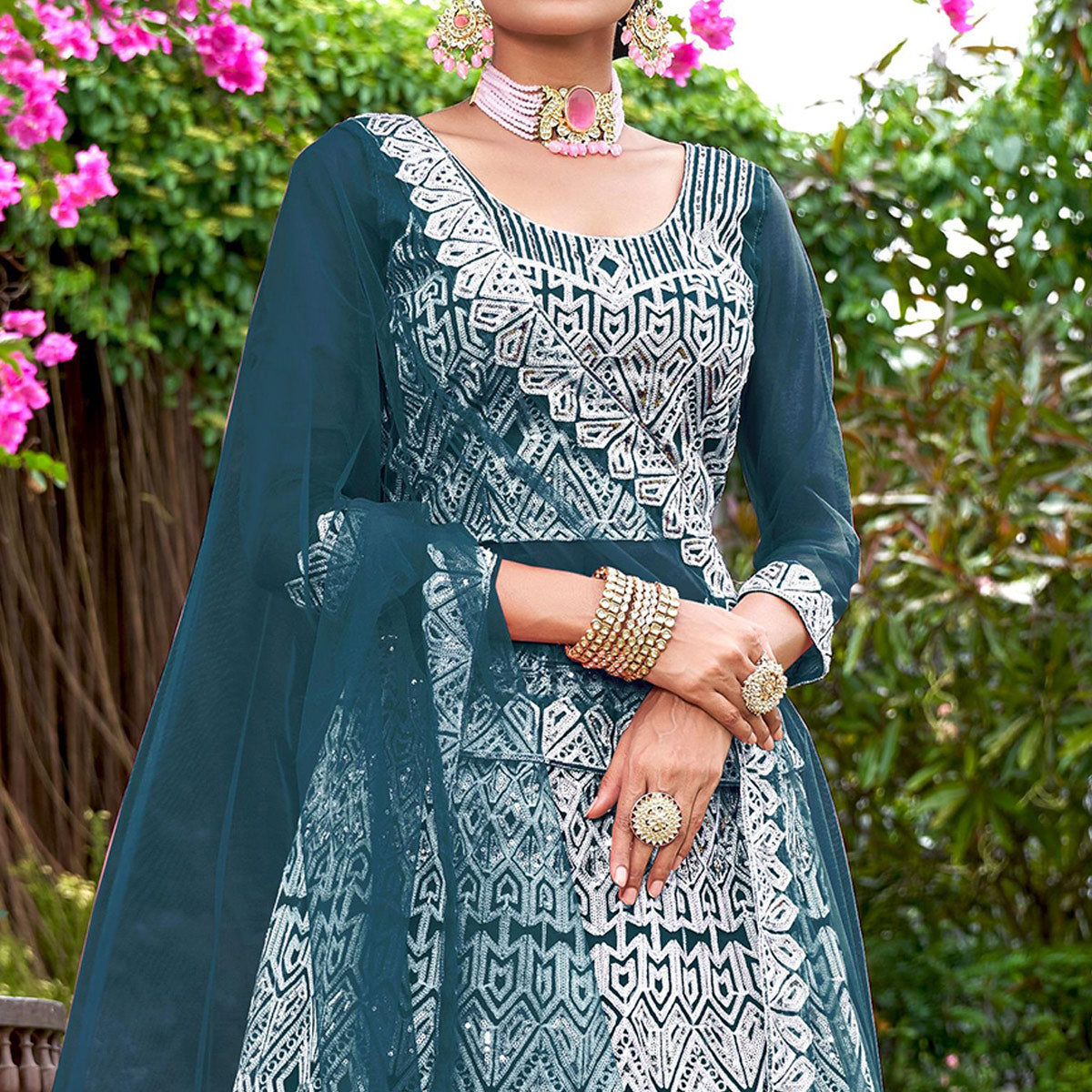 Teal Sequins Embroidered Net Semi Stitched Lehenga Choli