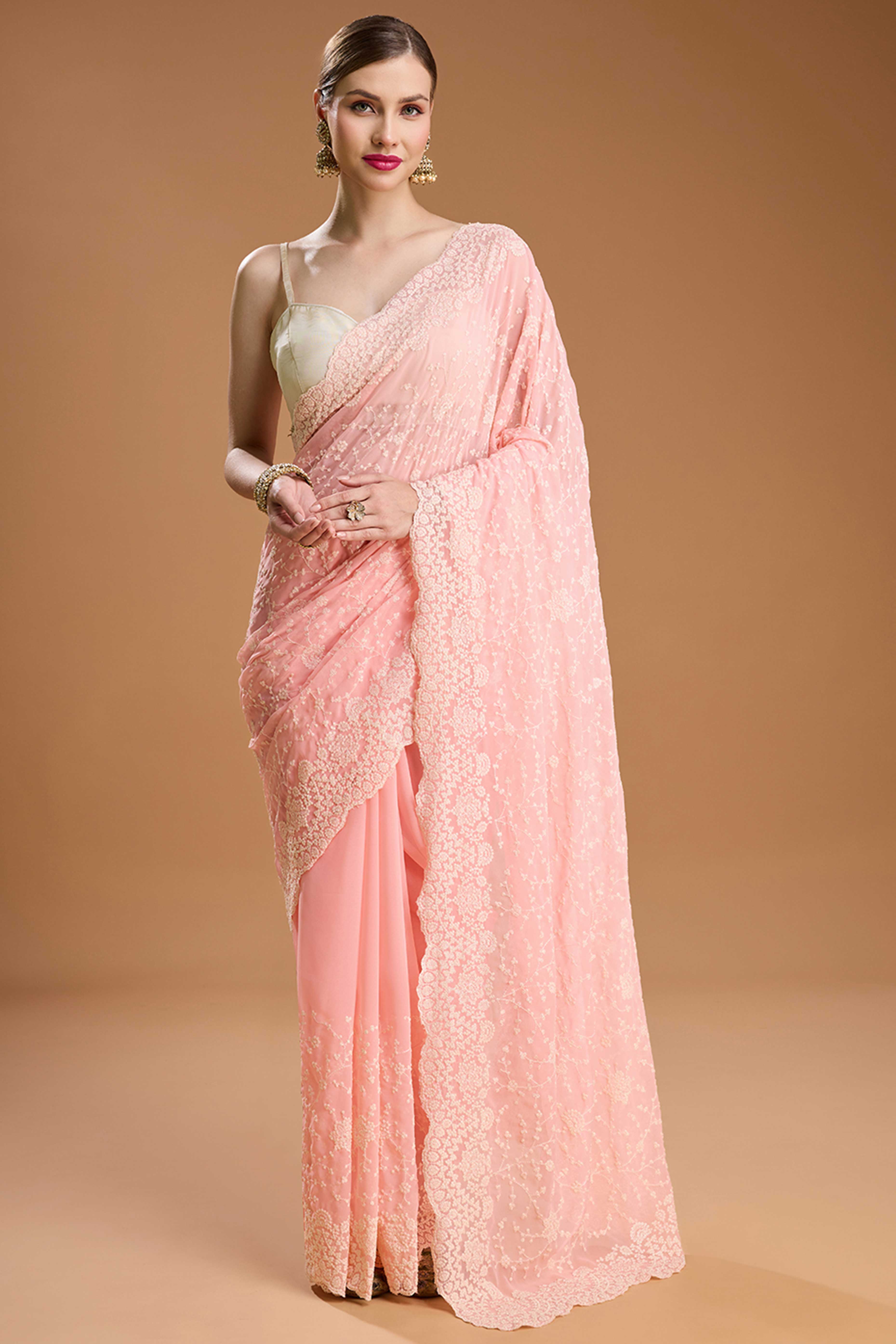 Soft Pastel Pink Embroidered Georgette Saree Featuring Thread Detailing