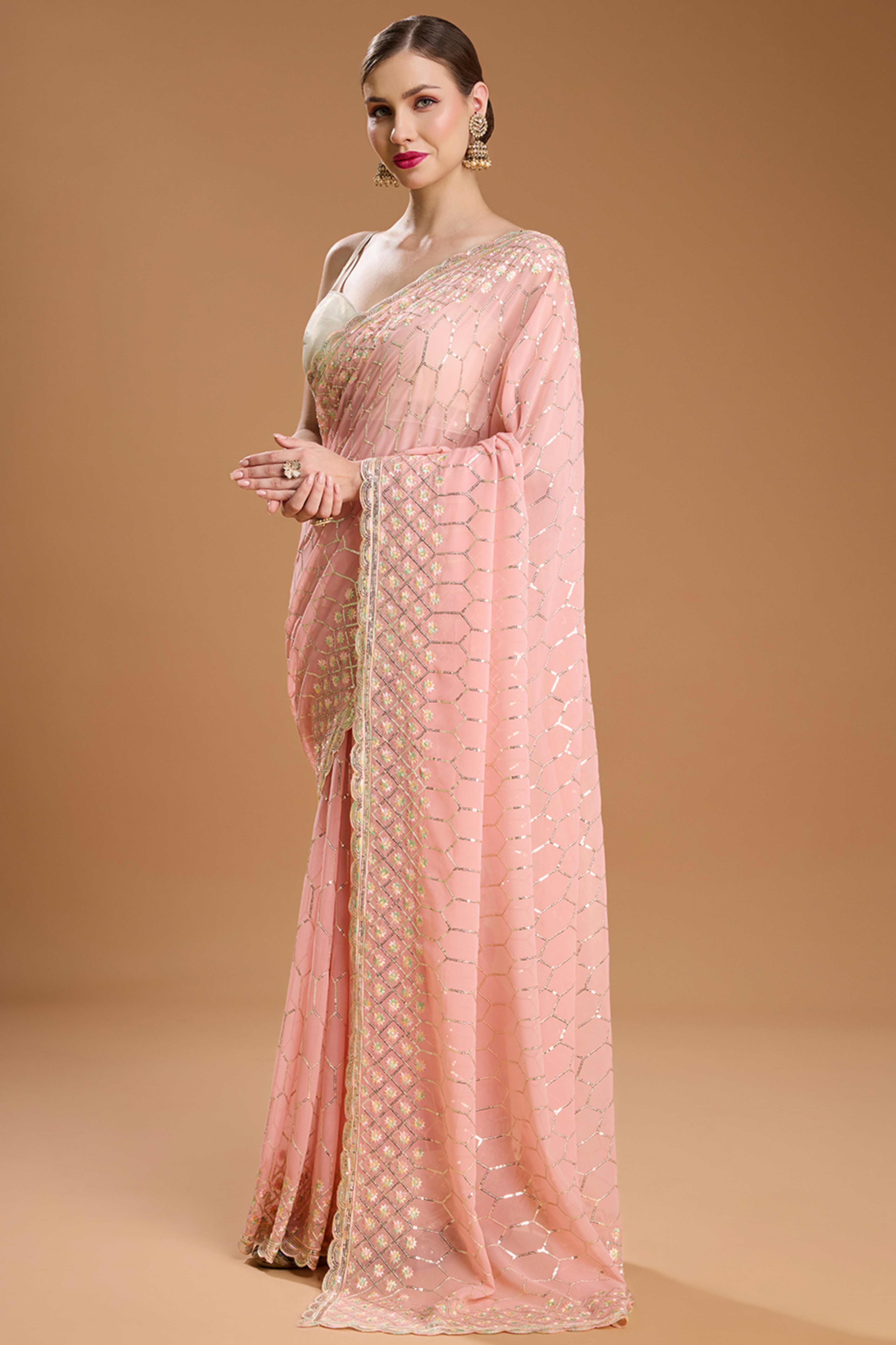Pastel Peach Georgette Saree Enhanced with Elegant Sequins Embellishments