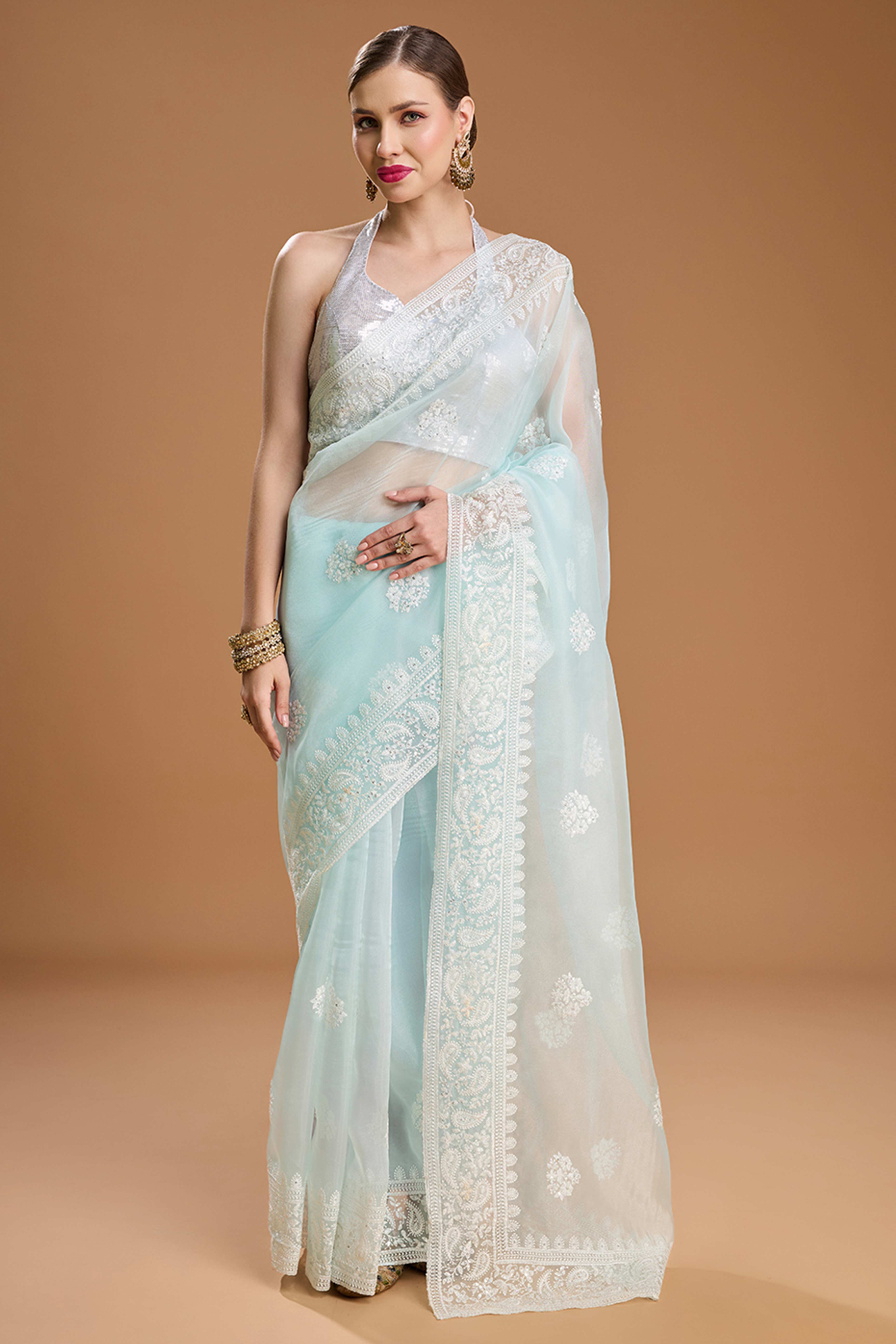 Mint Green Net Saree Enhanced with Elegant Sequins Embellishments
